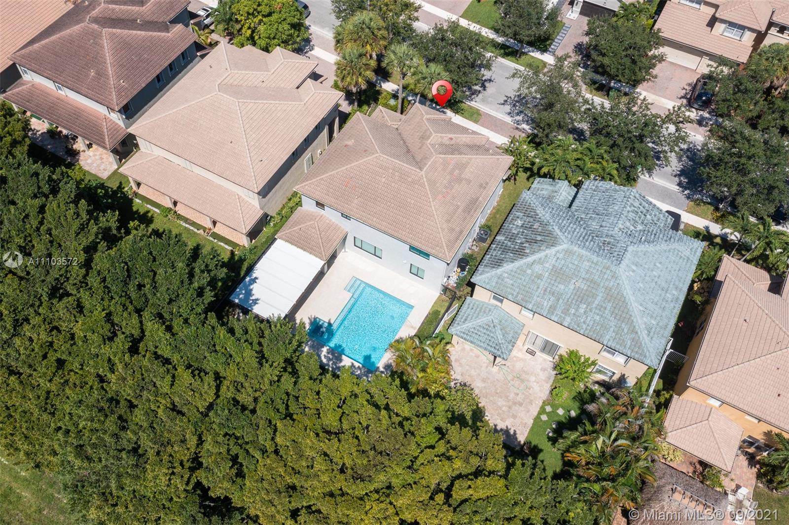 19124 Seneca Avenue Weston, FL 33332 - Photo 35 of 38 an aerial view of a house with a yard and garden