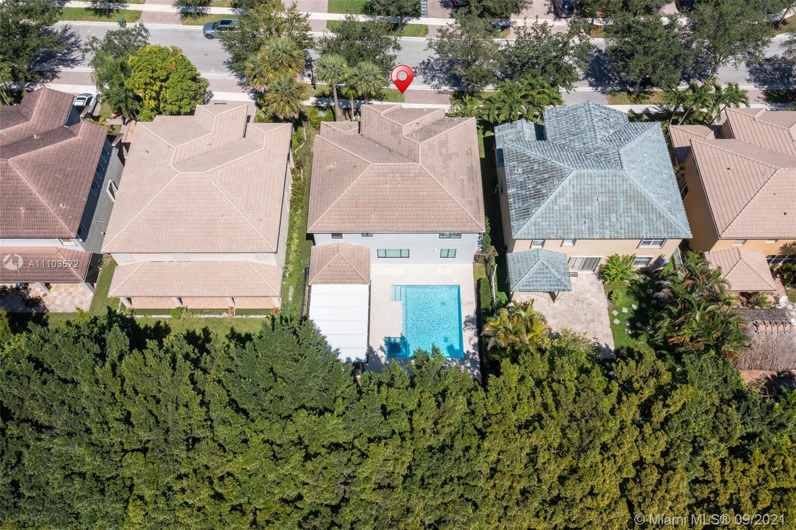 19124 Seneca Avenue Weston, FL 33332 - Photo 36 of 38 an aerial view of a house with a yard and garden