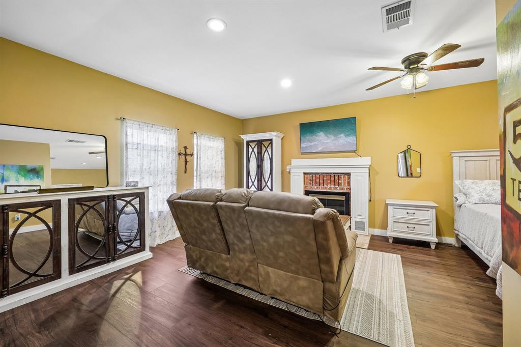 331 Radecke Road Krum, TX 76249 - Photo 31 of 40 Spacious primary bedroom featuring wood-finish flooring, recessed lighting, and a ceiling fan