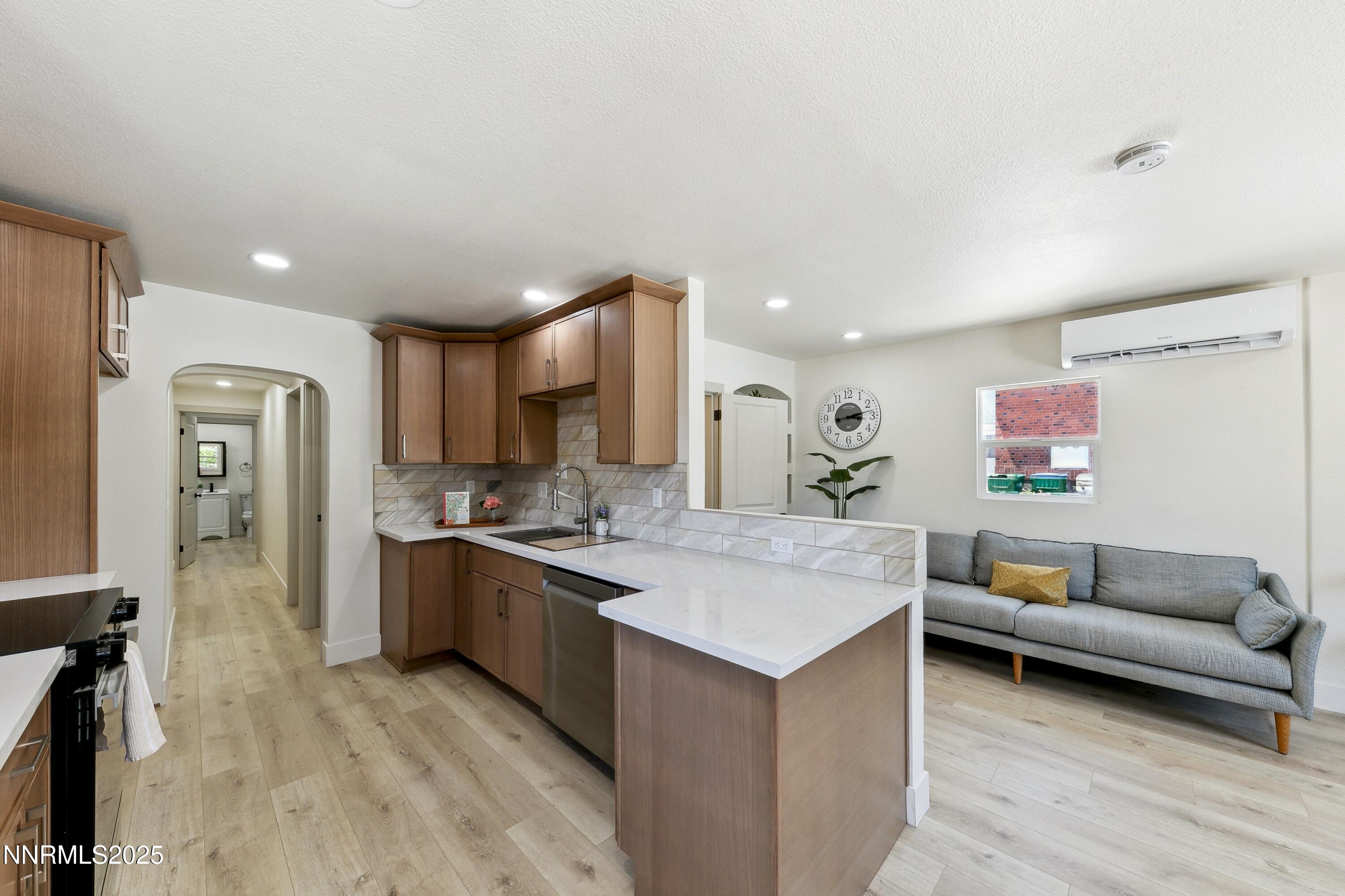 728 West Pueblo Street Reno, NV 89509 - Photo 13 of 33 a living room with stainless steel appliances granite countertop furniture and a wooden floor