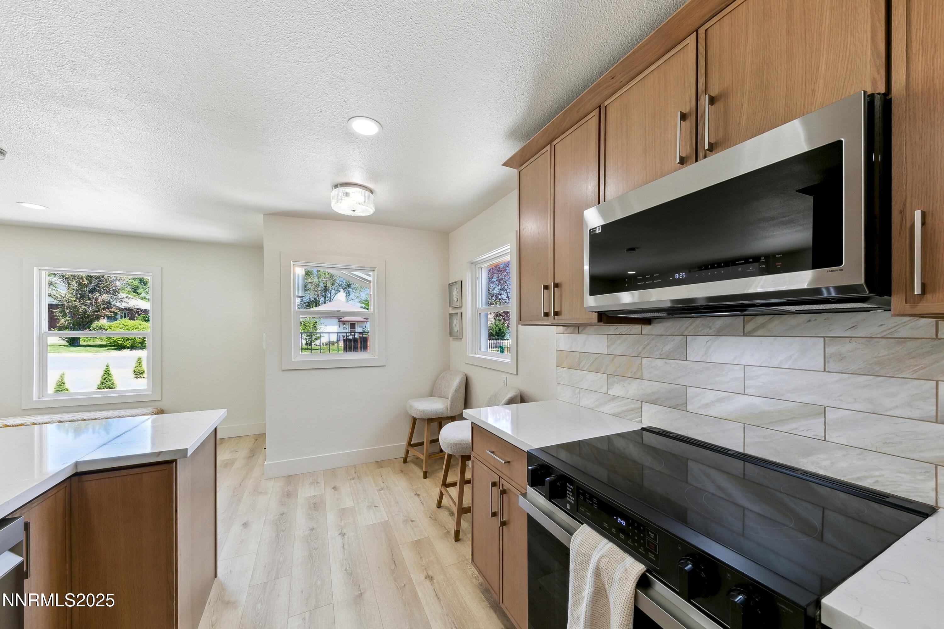 728 West Pueblo Street Reno, NV 89509 - Photo 15 of 33 a kitchen with a stove and a microwave