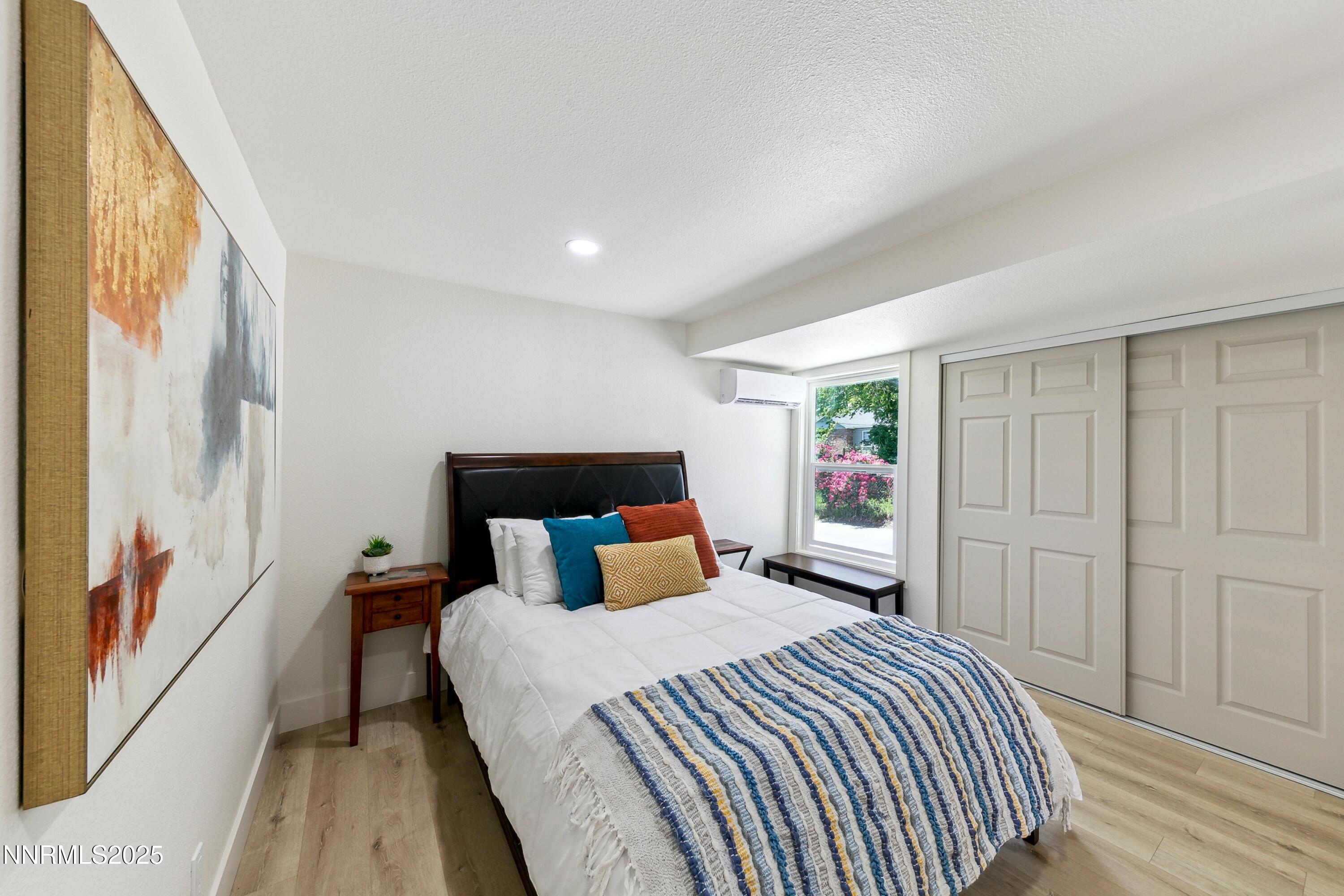 728 West Pueblo Street Reno, NV 89509 - Photo 16 of 33 a bedroom with a large bed and a window