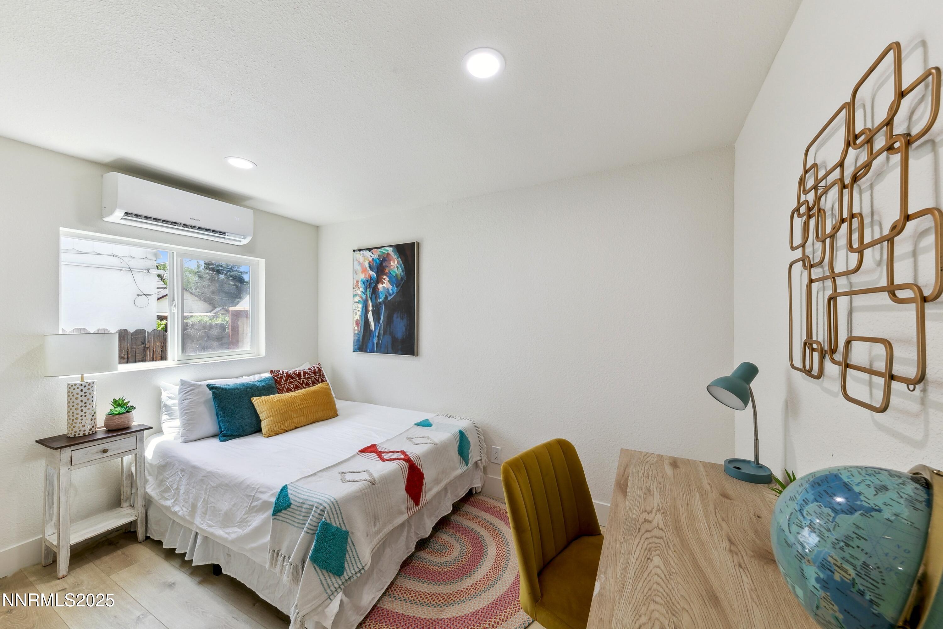 728 West Pueblo Street Reno, NV 89509 - Photo 20 of 33 a bedroom with a bed and wooden floor