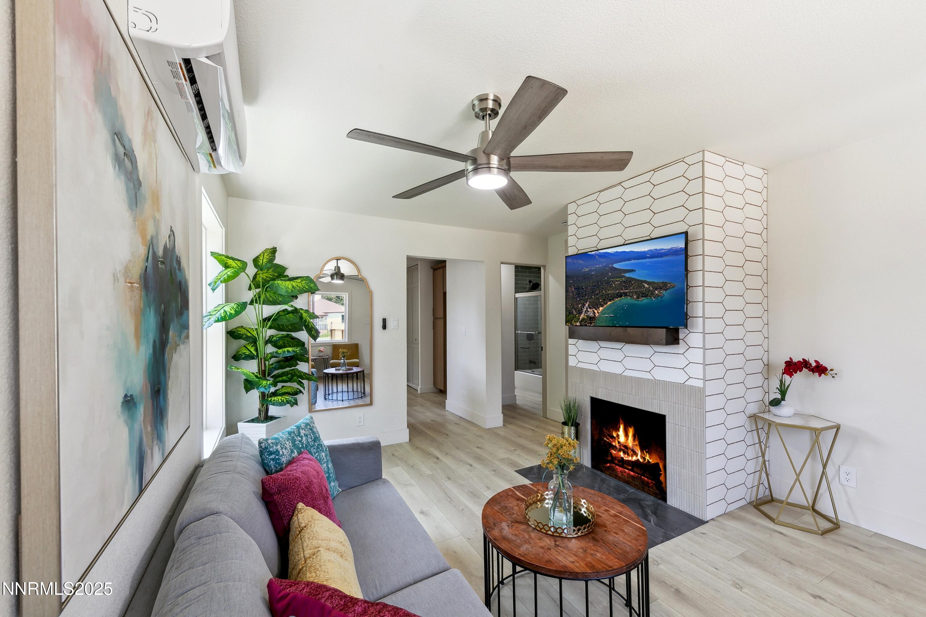 728 West Pueblo Street Reno, NV 89509 - Photo 24 of 33 a living room with furniture a flat screen tv and a fireplace