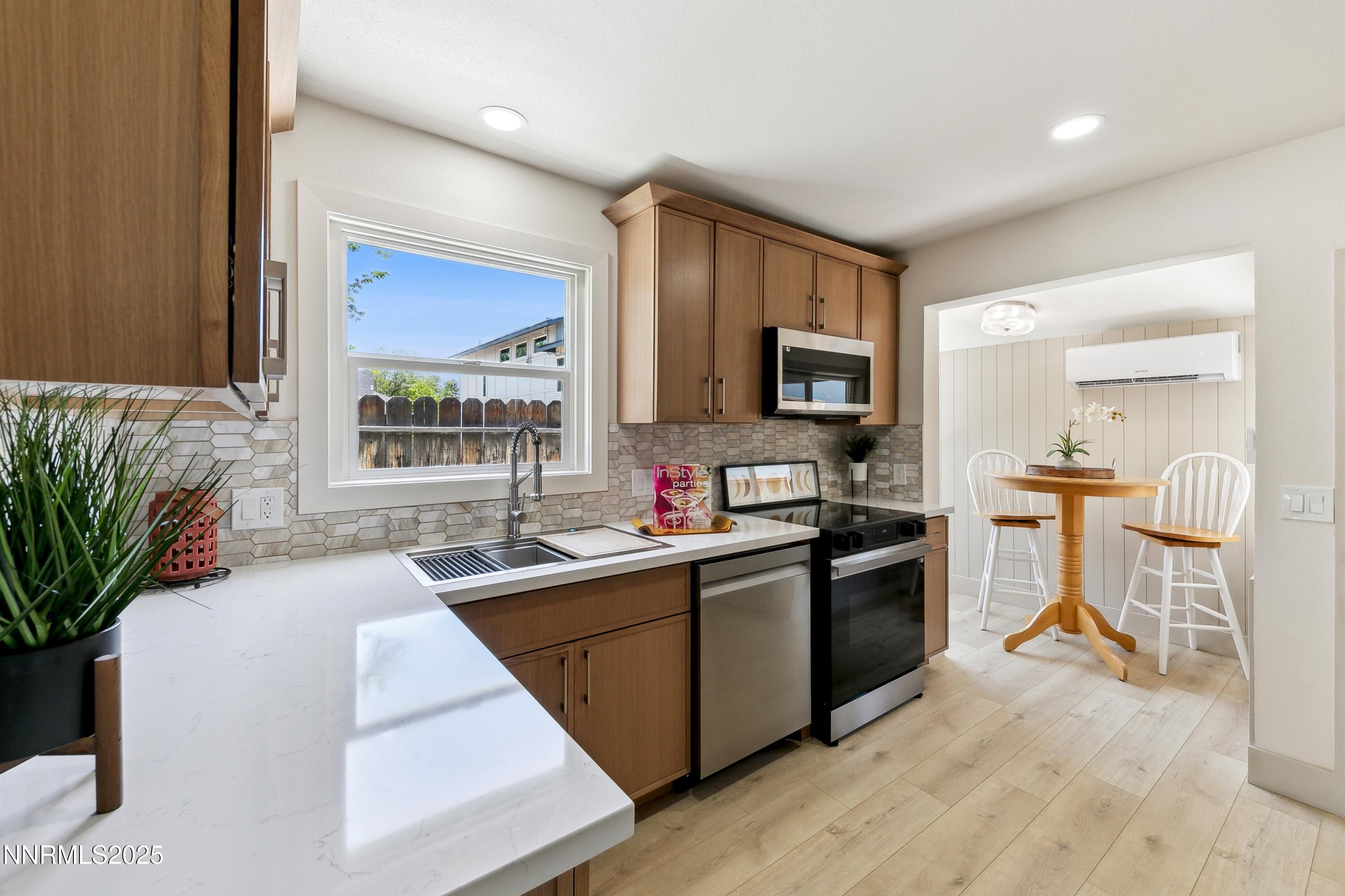 728 West Pueblo Street Reno, NV 89509 - Photo 27 of 33 a kitchen with a sink stove and microwave