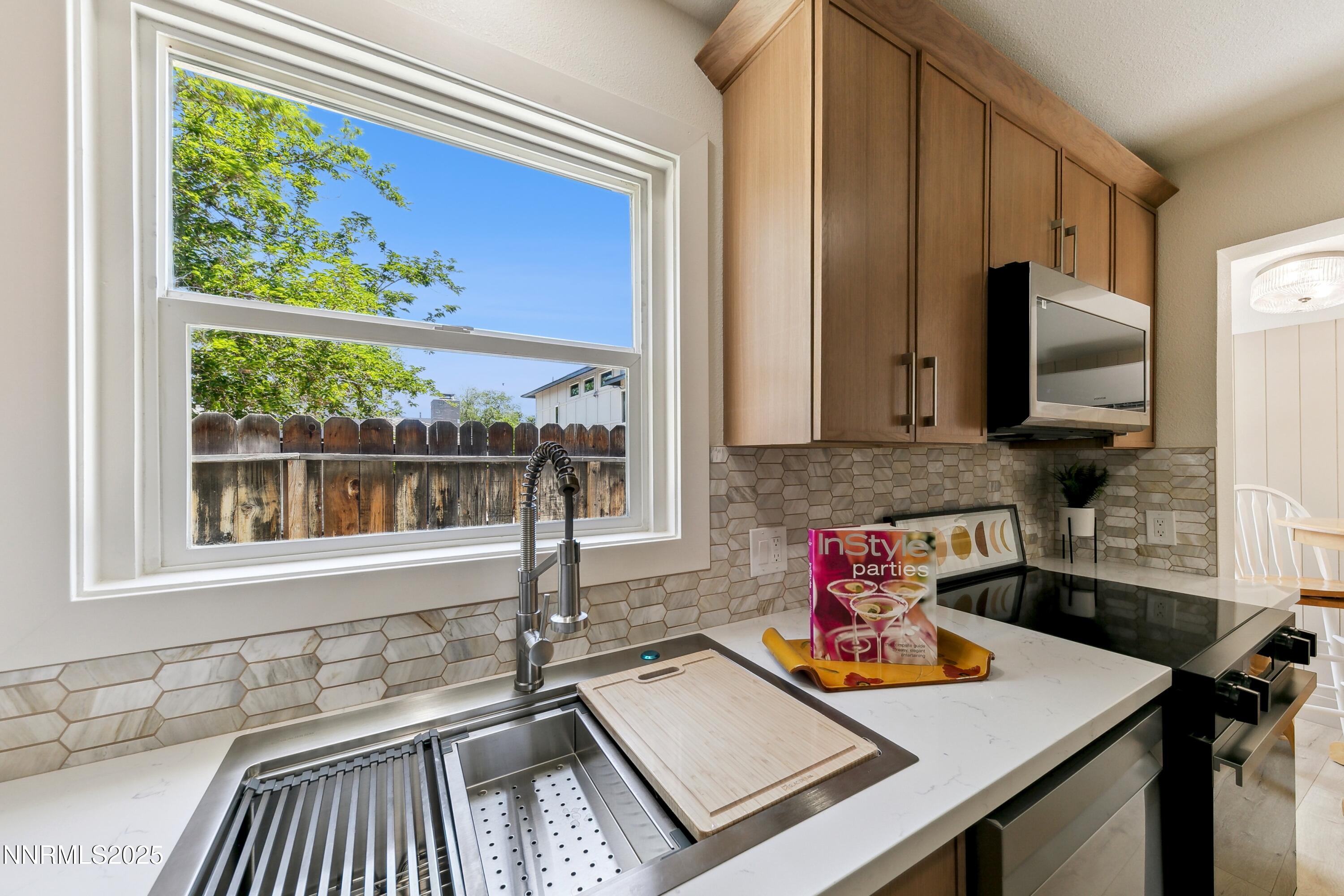 728 West Pueblo Street Reno, NV 89509 - Photo 28 of 33 a kitchen with a stove a sink and a window