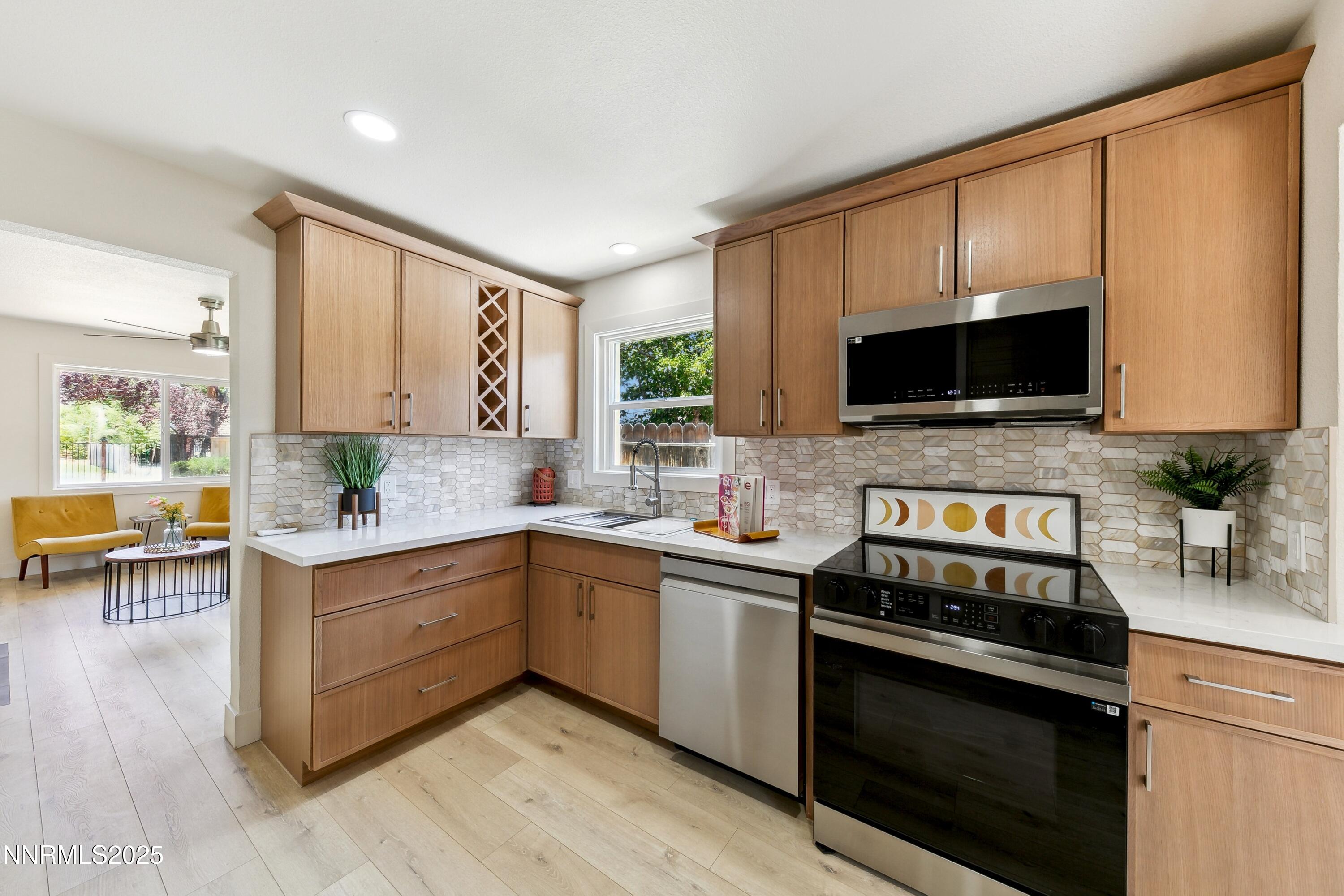 728 West Pueblo Street Reno, NV 89509 - Photo 29 of 33 a kitchen with a sink stove and cabinets
