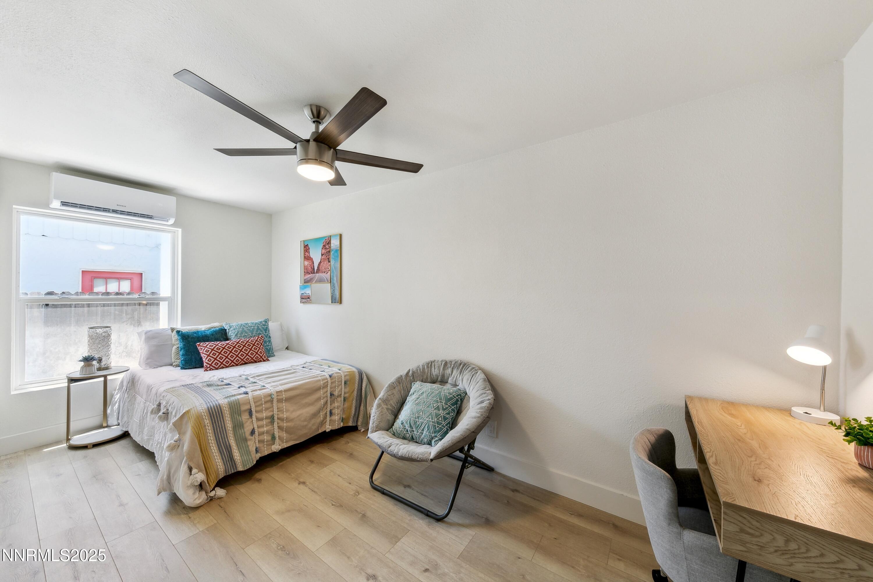 728 West Pueblo Street Reno, NV 89509 - Photo 31 of 33 a bedroom with a bed and a chair