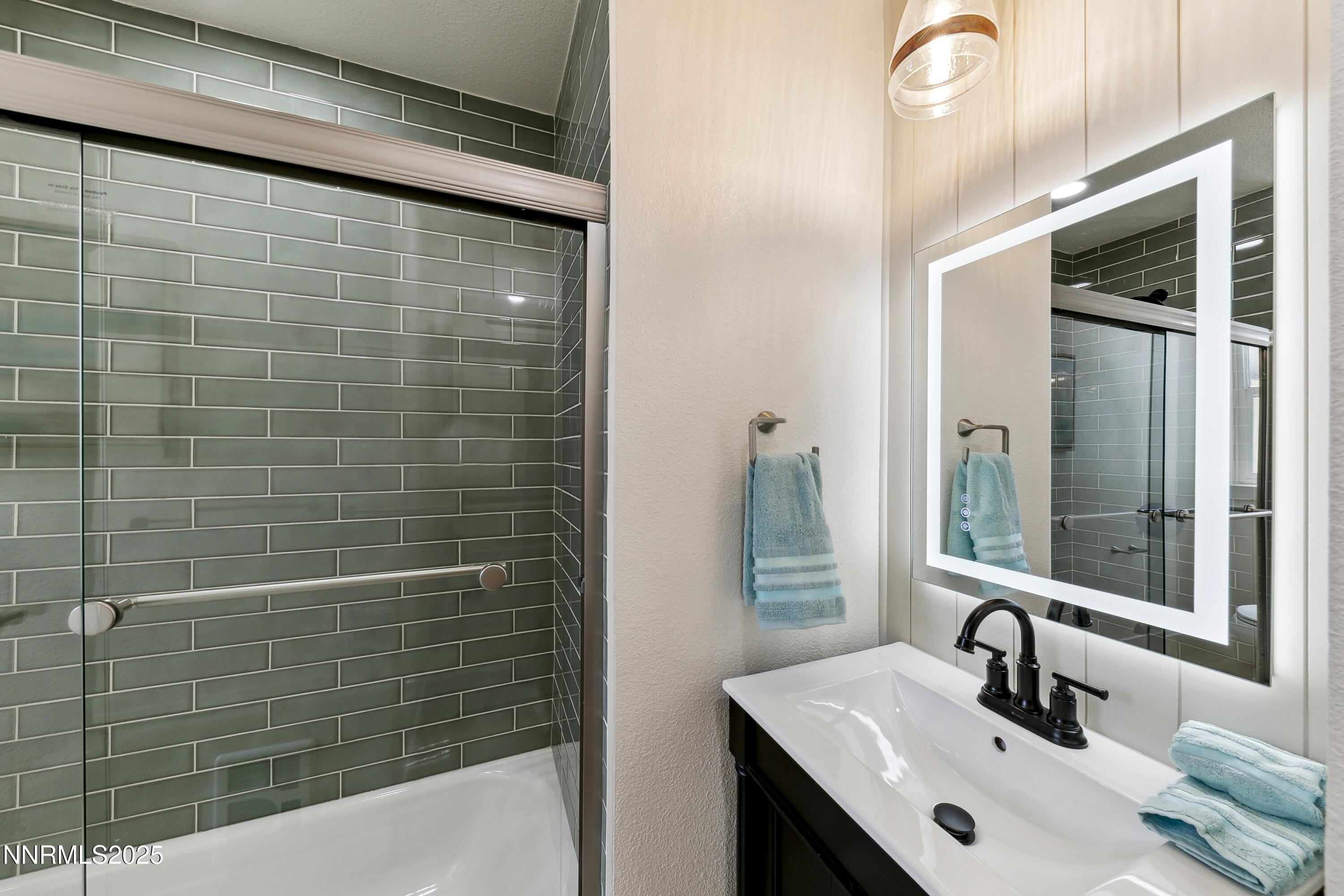 728 West Pueblo Street Reno, NV 89509 - Photo 32 of 33 a bathroom with a sink and mirror