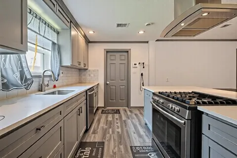 a bed room with a bed and a chair