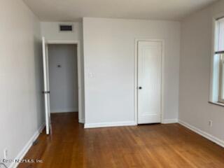 1781 River Road, Unit 4 Jacksonville, FL 32207 - Photo 15 of 24 a view of an empty room with wooden floor and a window