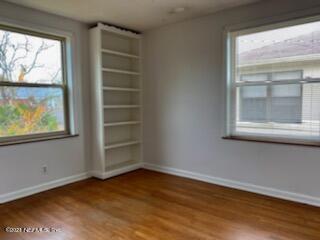 1781 River Road, Unit 4 Jacksonville, FL 32207 - Photo 19 of 24 a view of an empty room with wooden floor and a window