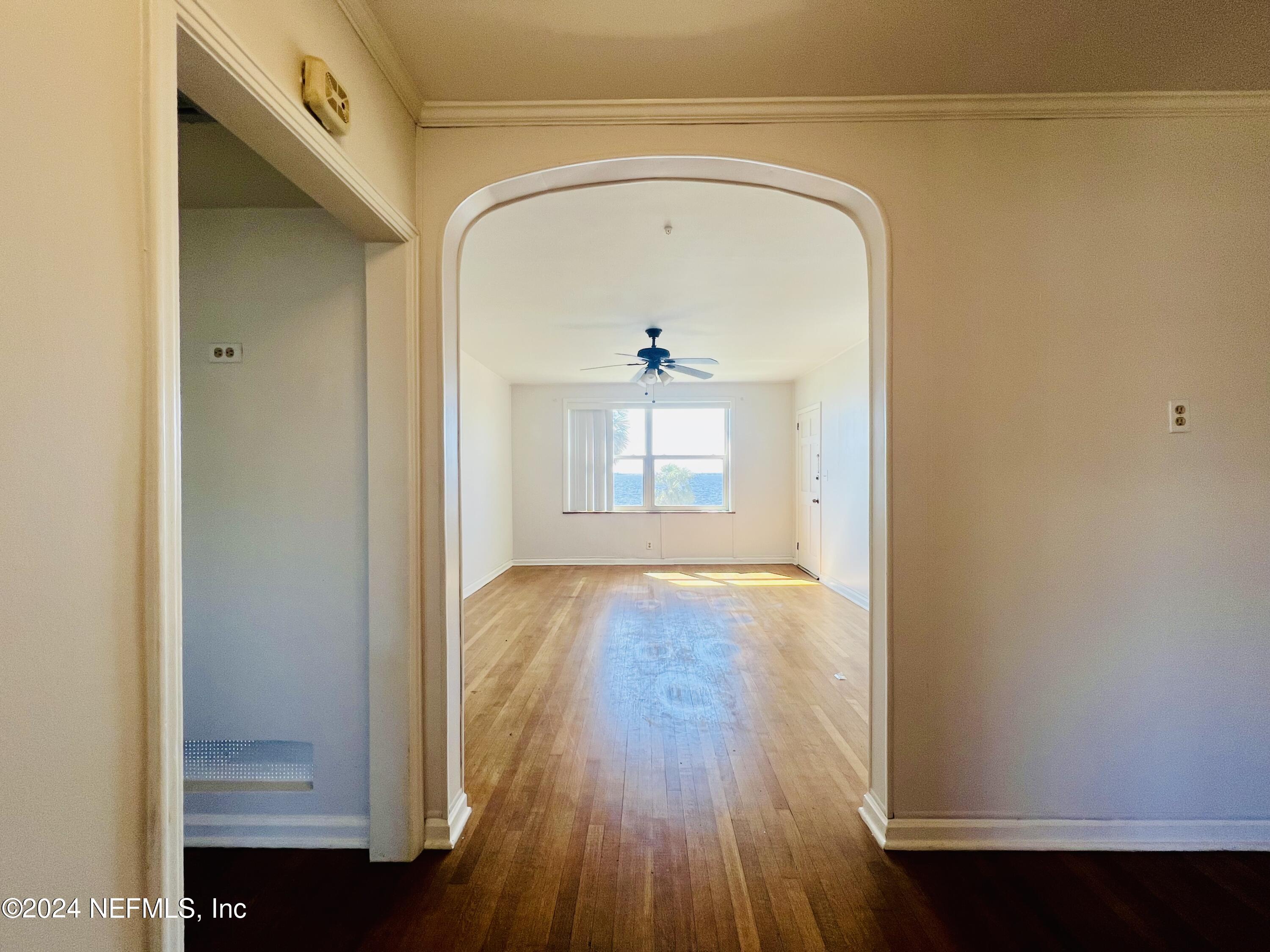 1781 River Road, Unit 4 Jacksonville, FL 32207 - Photo 9 of 24 a view of a hallway with wooden floor and a cabinet