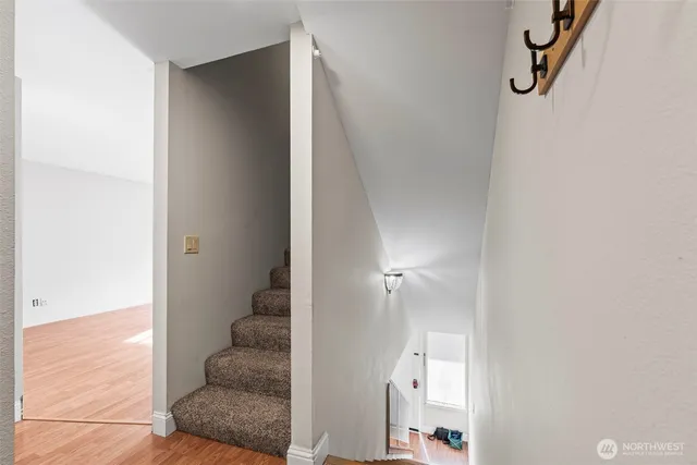 a bedroom with a bed and a ceiling fan