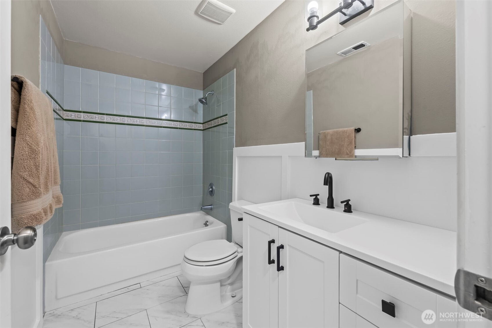 17303 Spanaway Loop Road South, Unit 18 Spanaway, WA 98387 - Photo 19 of 33 a bathroom with a sink toilet and shower