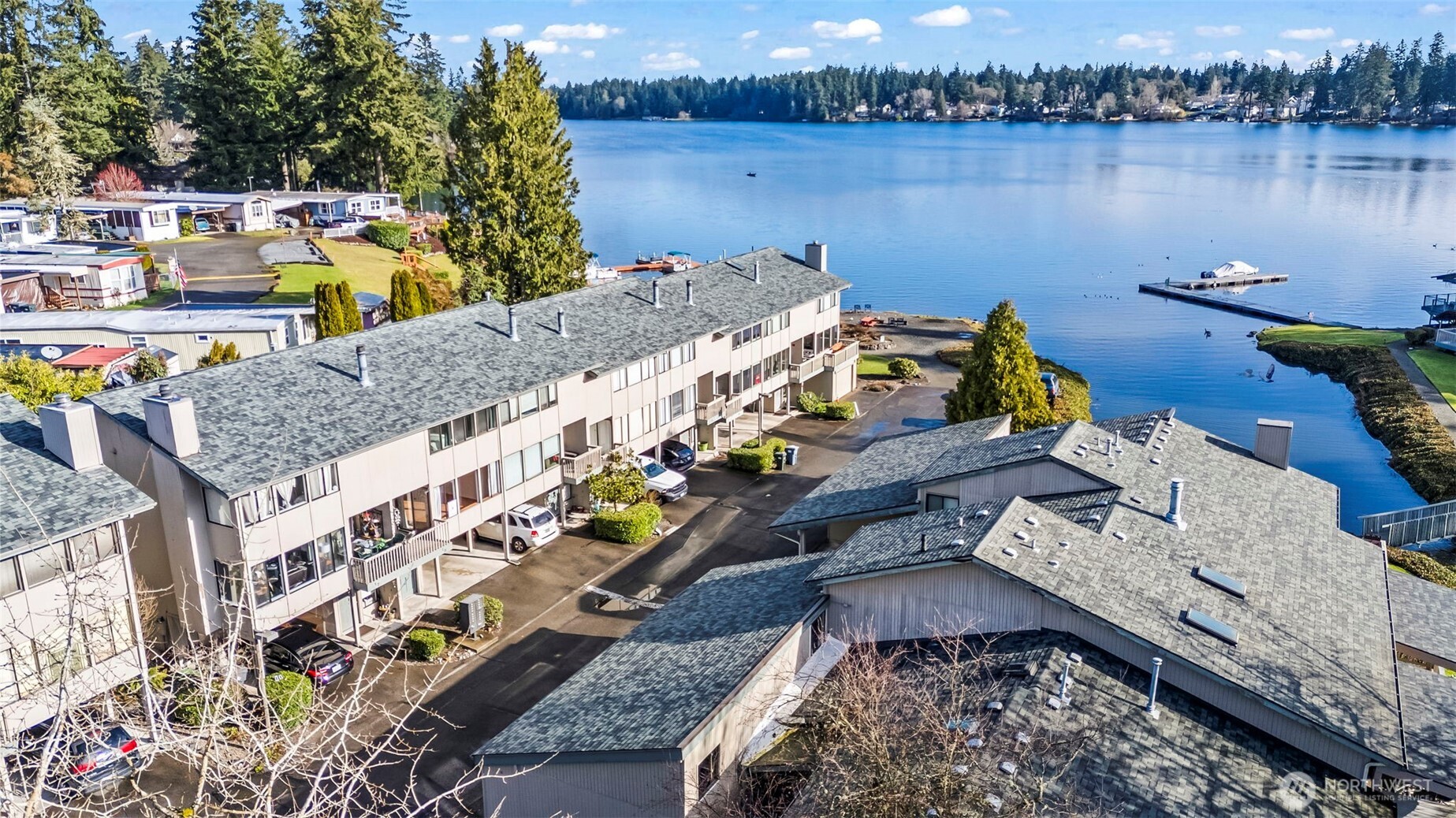 17303 Spanaway Loop Road South, Unit 18 Spanaway, WA 98387 - Photo 24 of 33 an aerial view of a house with a lake view
