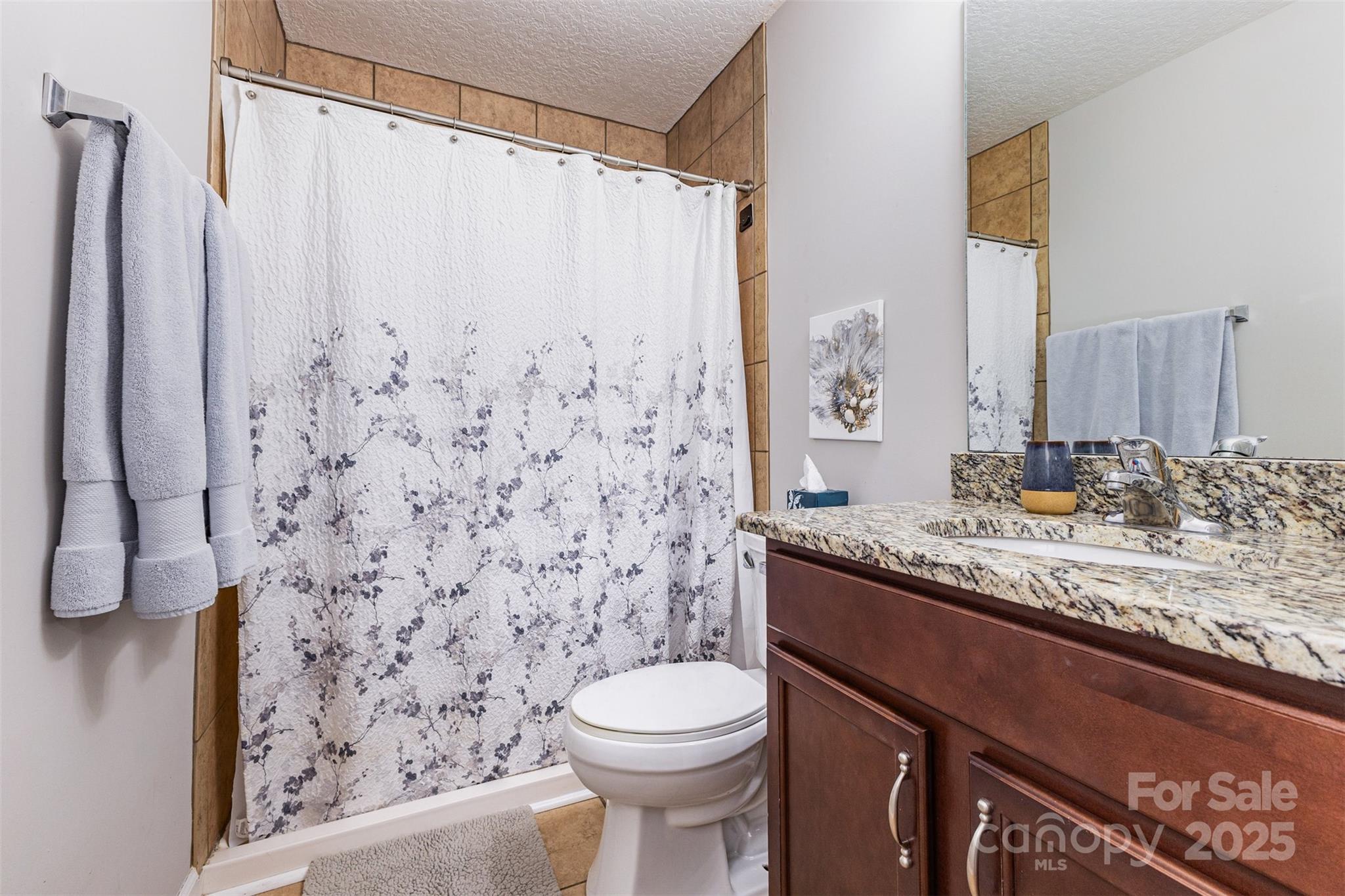 439 Pamela Road York, SC 29745 - Photo 17 of 35 a bathroom with a granite countertop sink toilet and shower