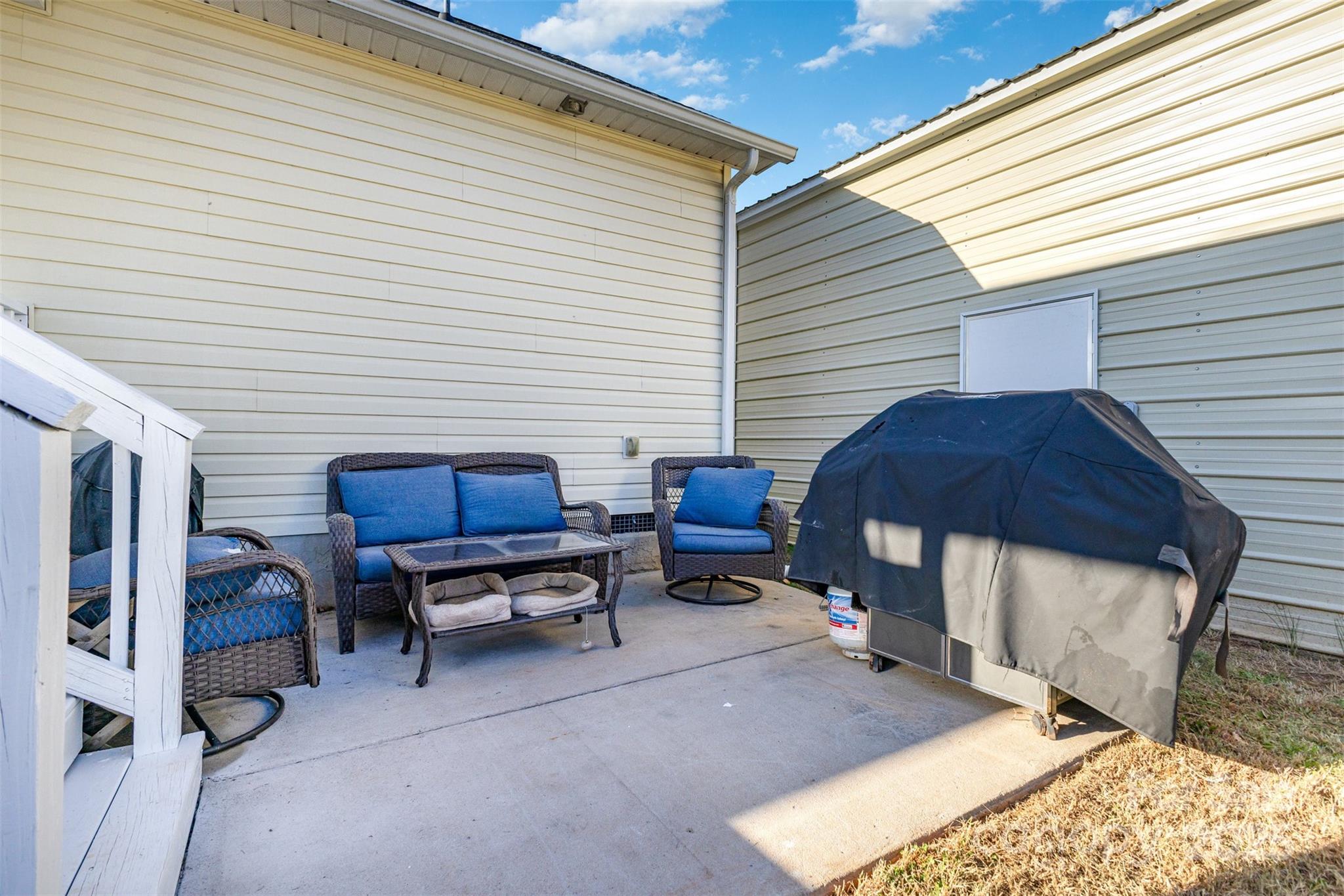 439 Pamela Road York, SC 29745 - Photo 21 of 35 a view of a patio with a table and chairs and a barbeque