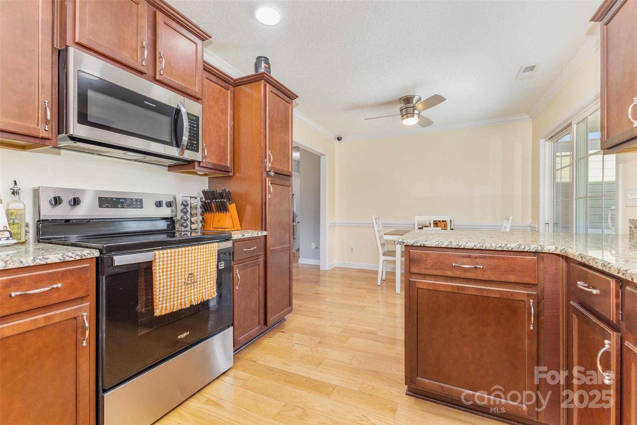 439 Pamela Road York, SC 29745 - Photo 7 of 35 a kitchen with stainless steel appliances granite countertop a stove a sink and a microwave