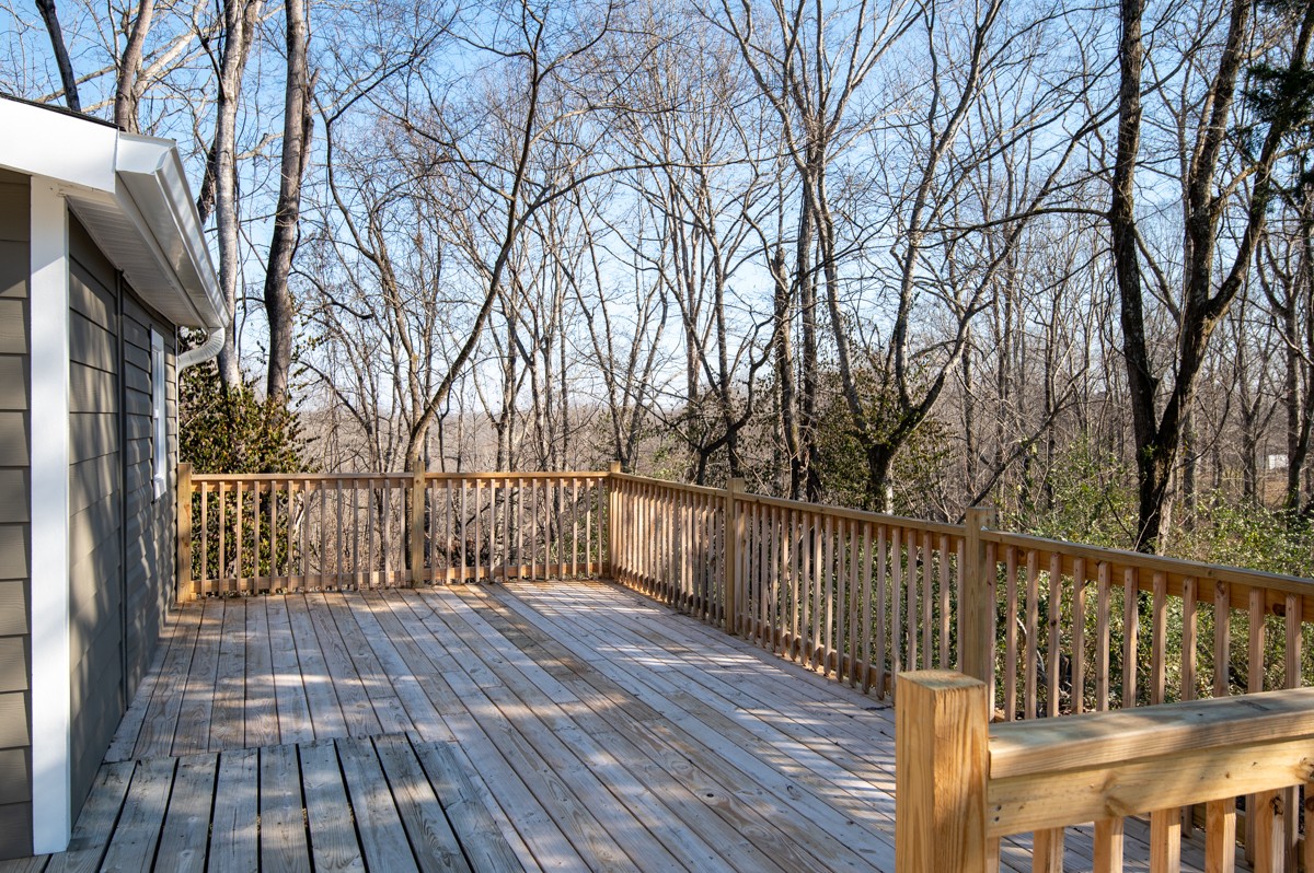 335 Columbia Avenue Centerville, TN 37033 - Photo 22 of 25 a balcony with wooden floor and trees