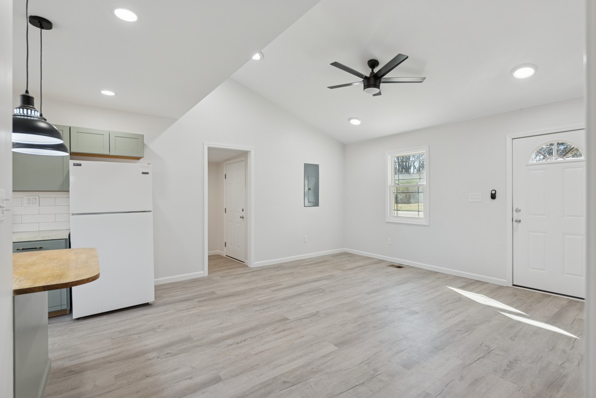 335 Columbia Avenue Centerville, TN 37033 - Photo 6 of 25 a view of an empty room with a window and kitchen view