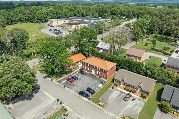 an aerial view of a house with outdoor space
