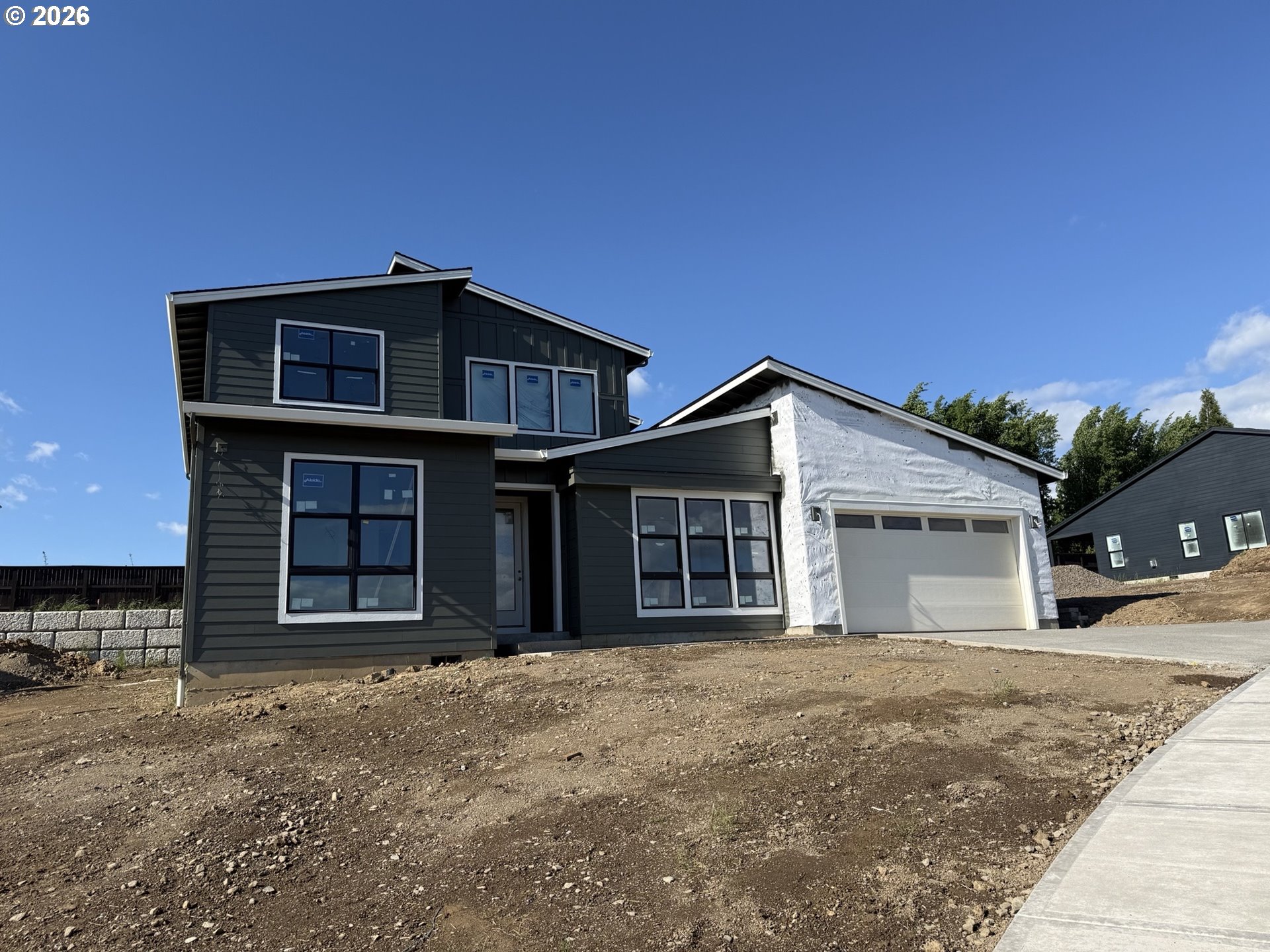 3800 South 16th Way, Unit L5 Ridgefield, WA 98642 - Photo 48 of 48 a front view of a house with a yard