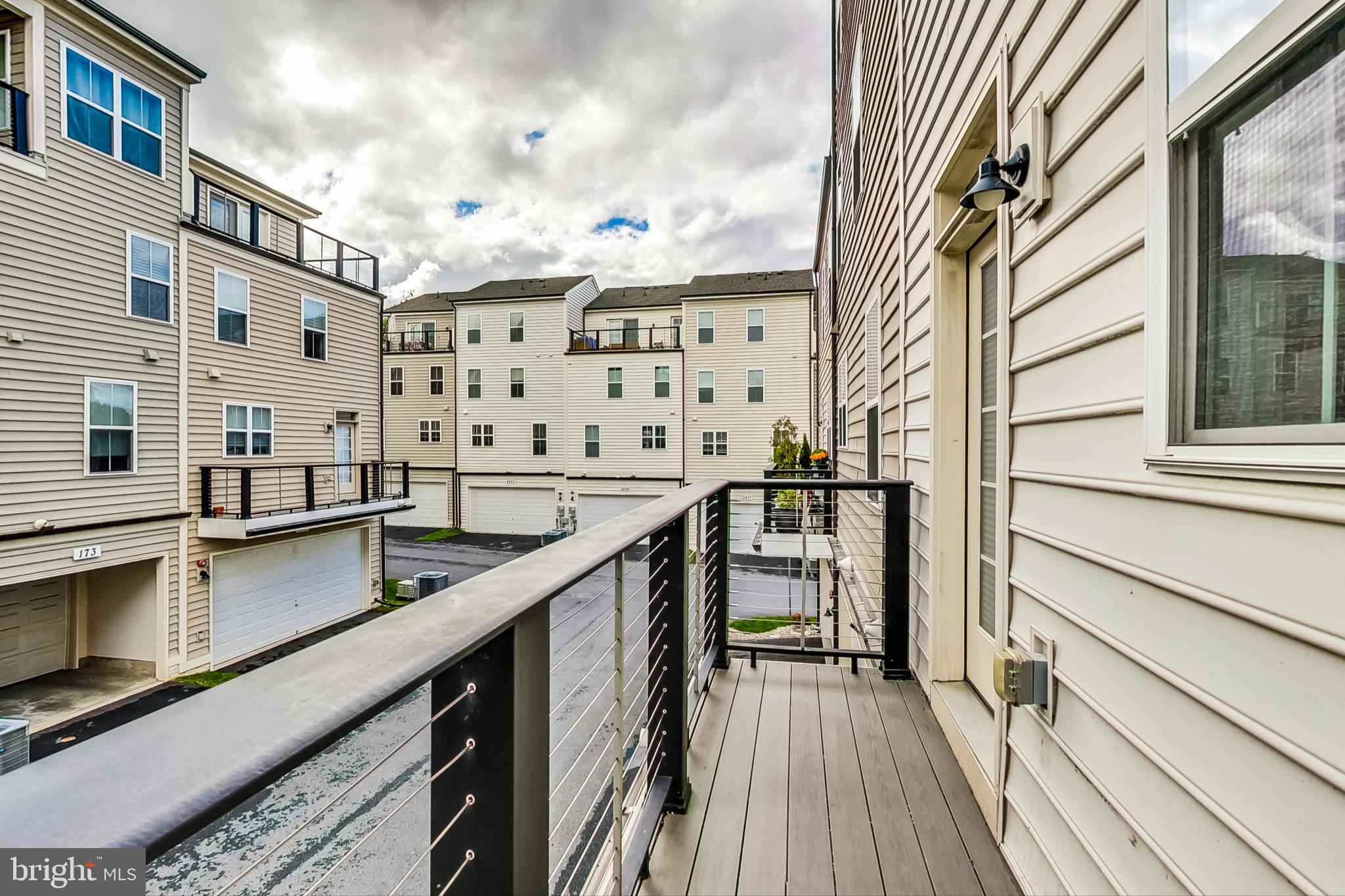 12609 Macaulay Street Silver Spring, MD 20906 - Photo 17 of 38 a balcony with street view and wooden floor