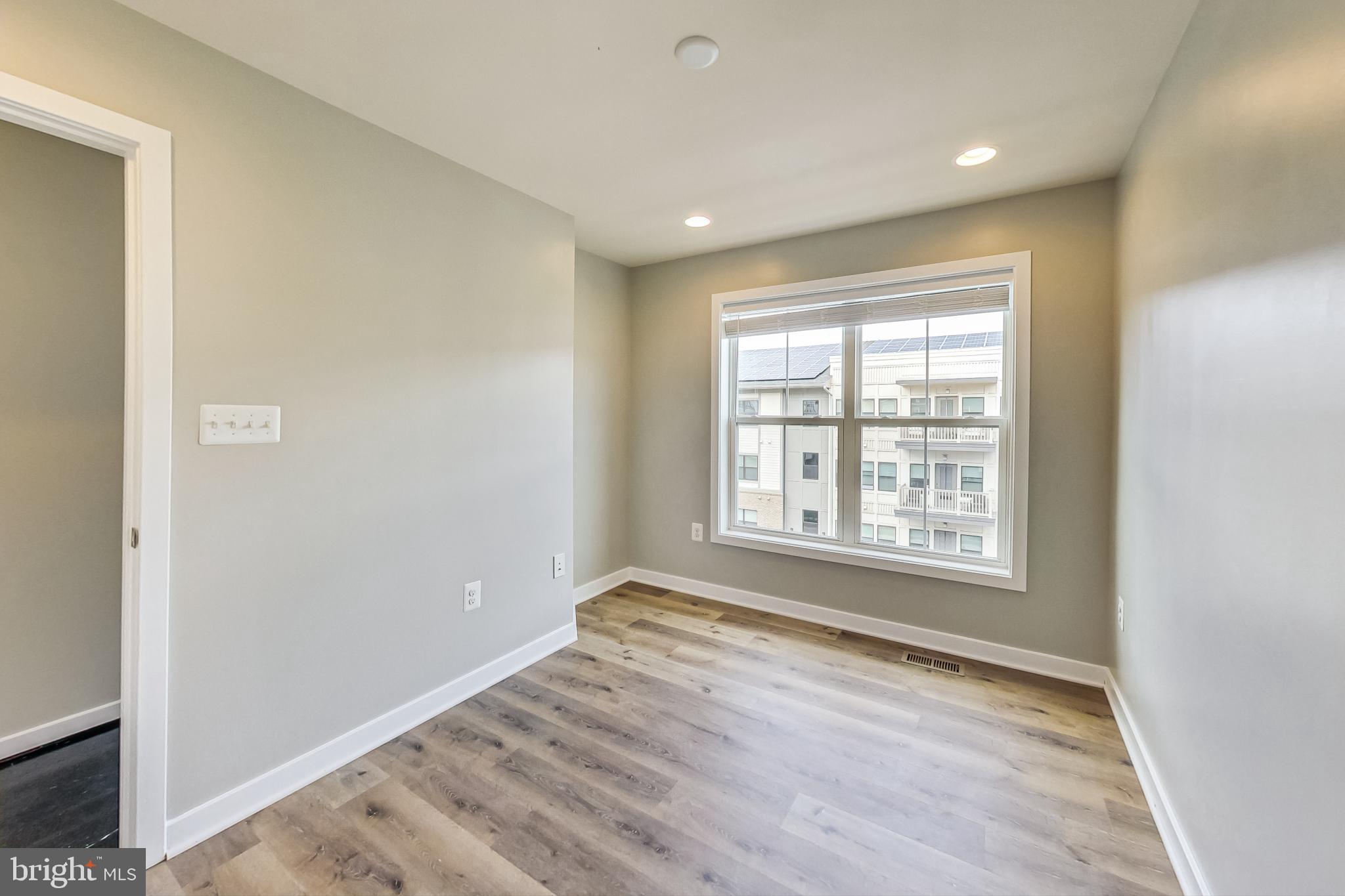 12609 Macaulay Street Silver Spring, MD 20906 - Photo 22 of 38 a view of an empty room with a window
