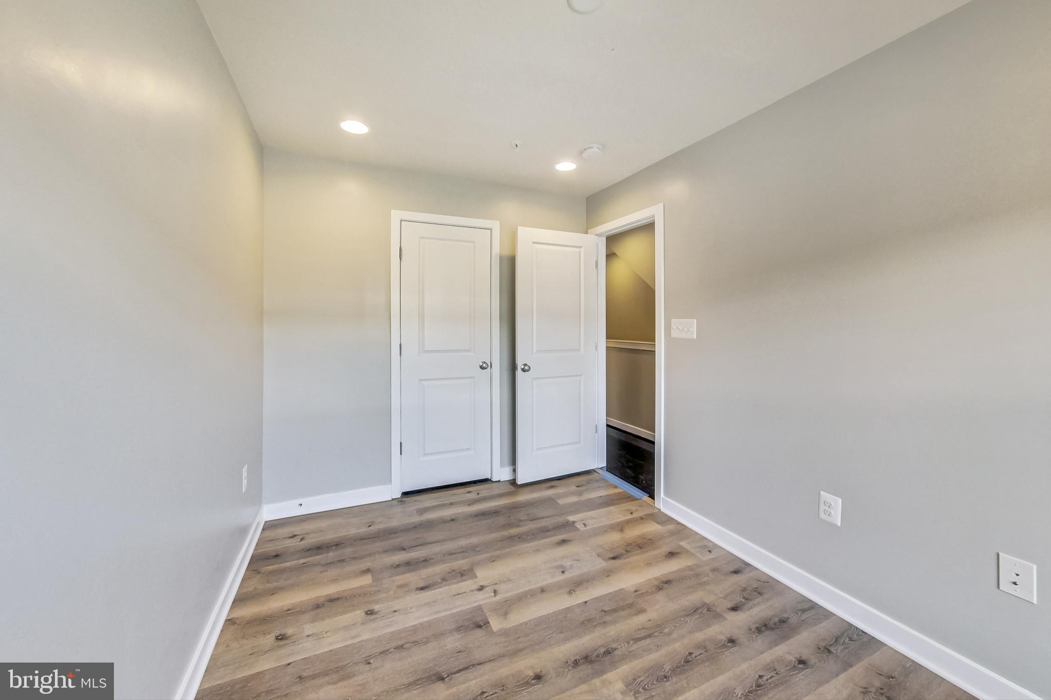 12609 Macaulay Street Silver Spring, MD 20906 - Photo 23 of 38 a view of hallway with wooden floor