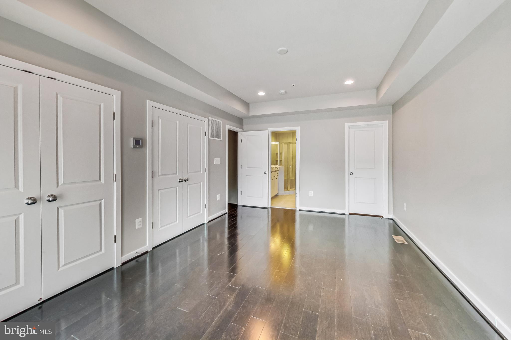 12609 Macaulay Street Silver Spring, MD 20906 - Photo 29 of 38 a view of an empty room with wooden floor