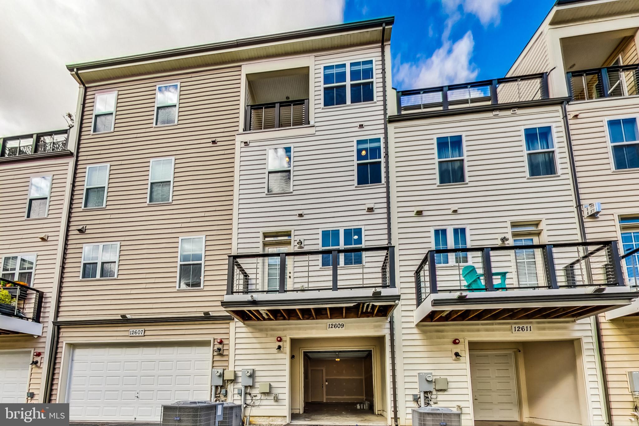12609 Macaulay Street Silver Spring, MD 20906 - Photo 36 of 38 a view of a house with large windows