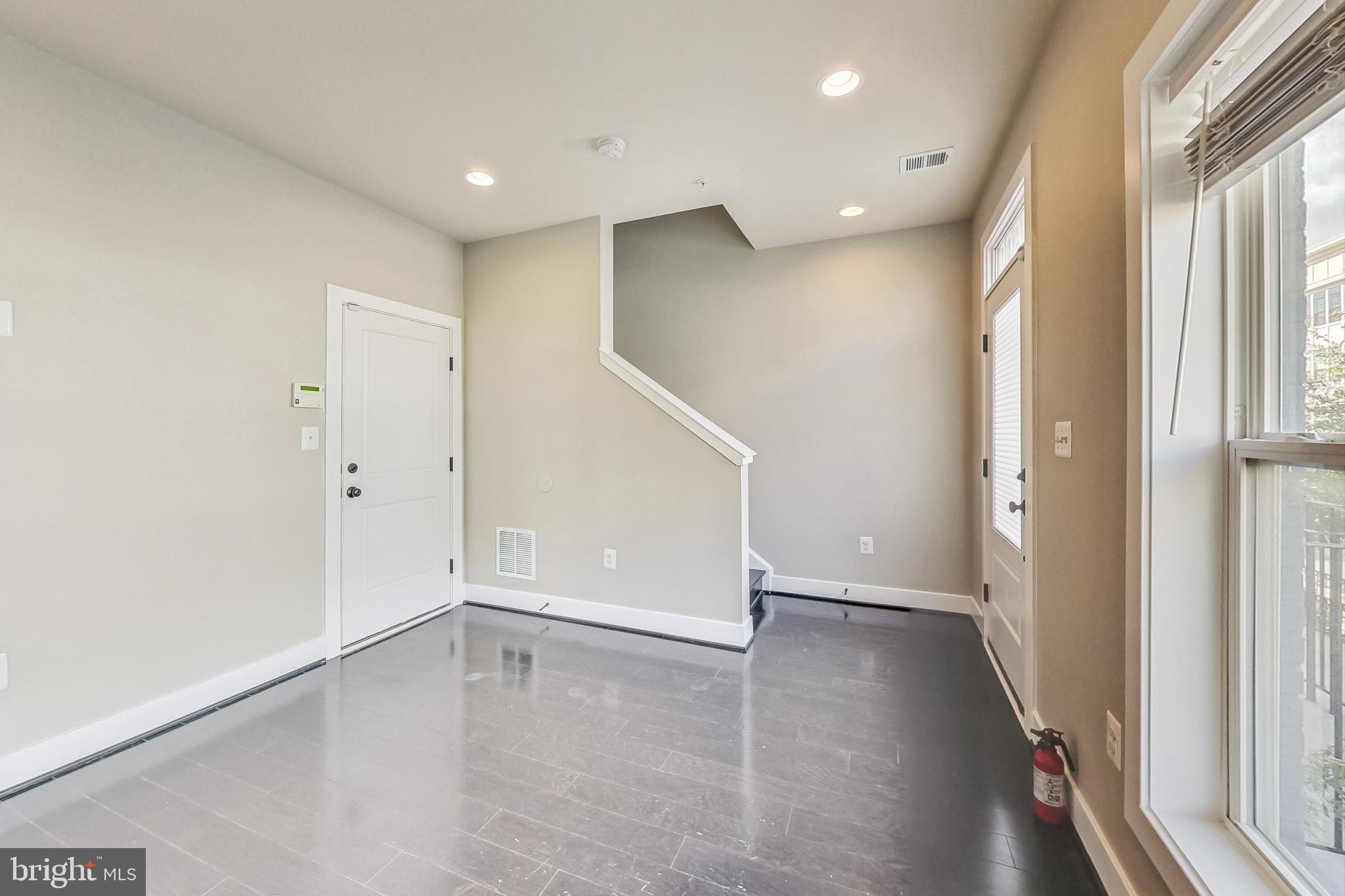 12609 Macaulay Street Silver Spring, MD 20906 - Photo 6 of 38 wooden floor in an empty room with a window