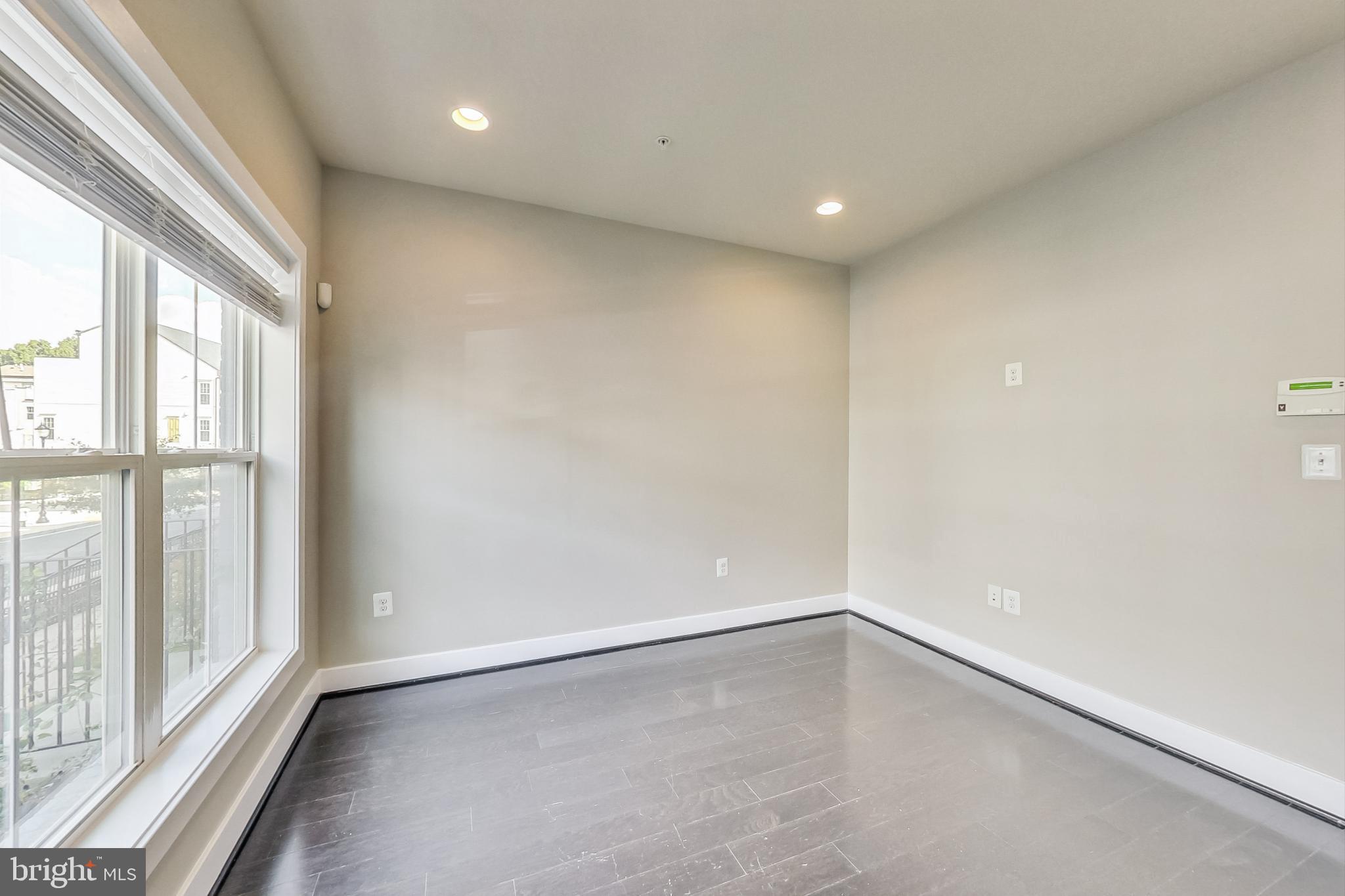 12609 Macaulay Street Silver Spring, MD 20906 - Photo 7 of 38 a view of an empty room with a window