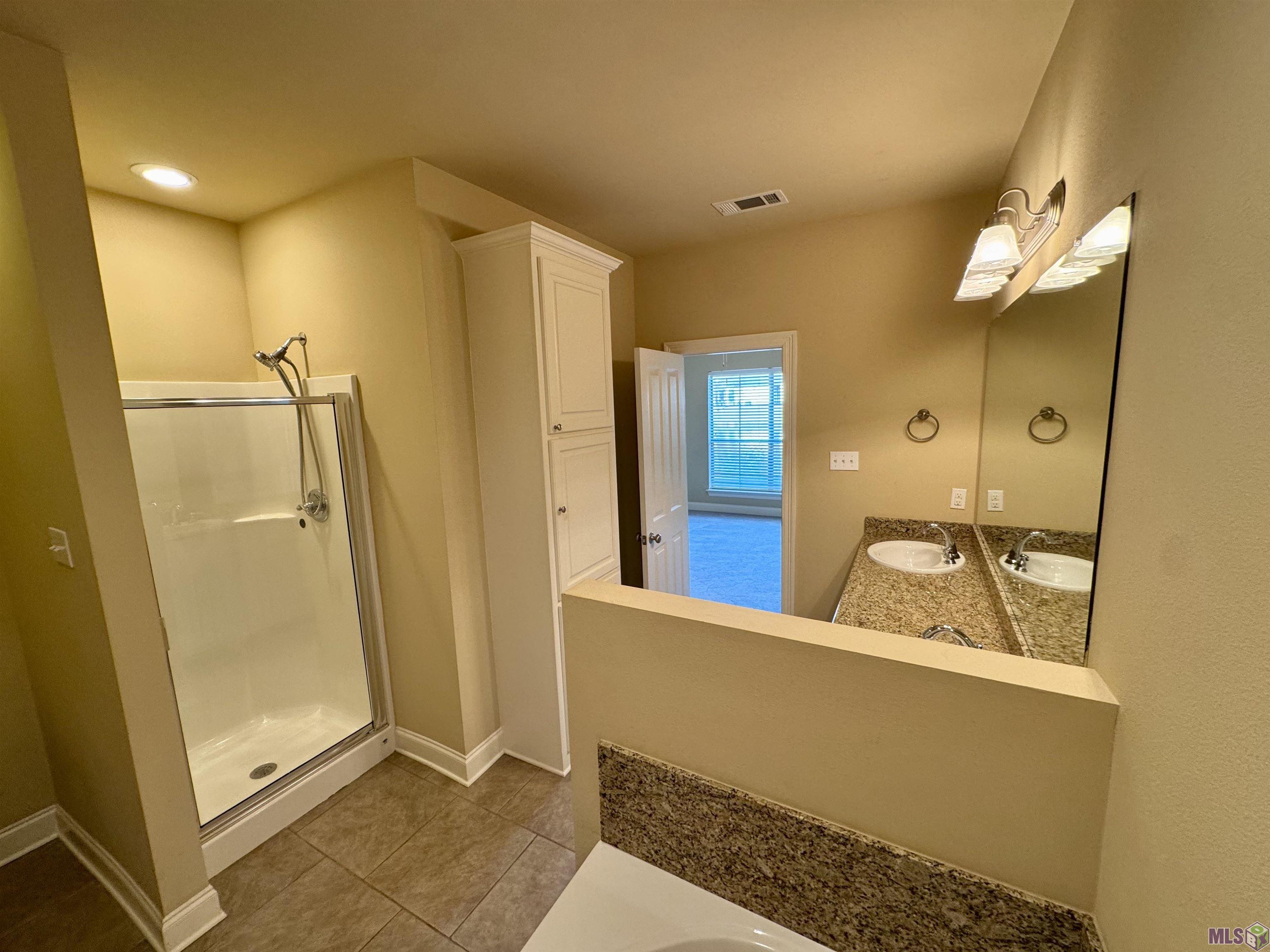 18019 Spring Creek Drive Baton Rouge, LA 70817 - Photo 11 of 16 Separate Shower & Tub