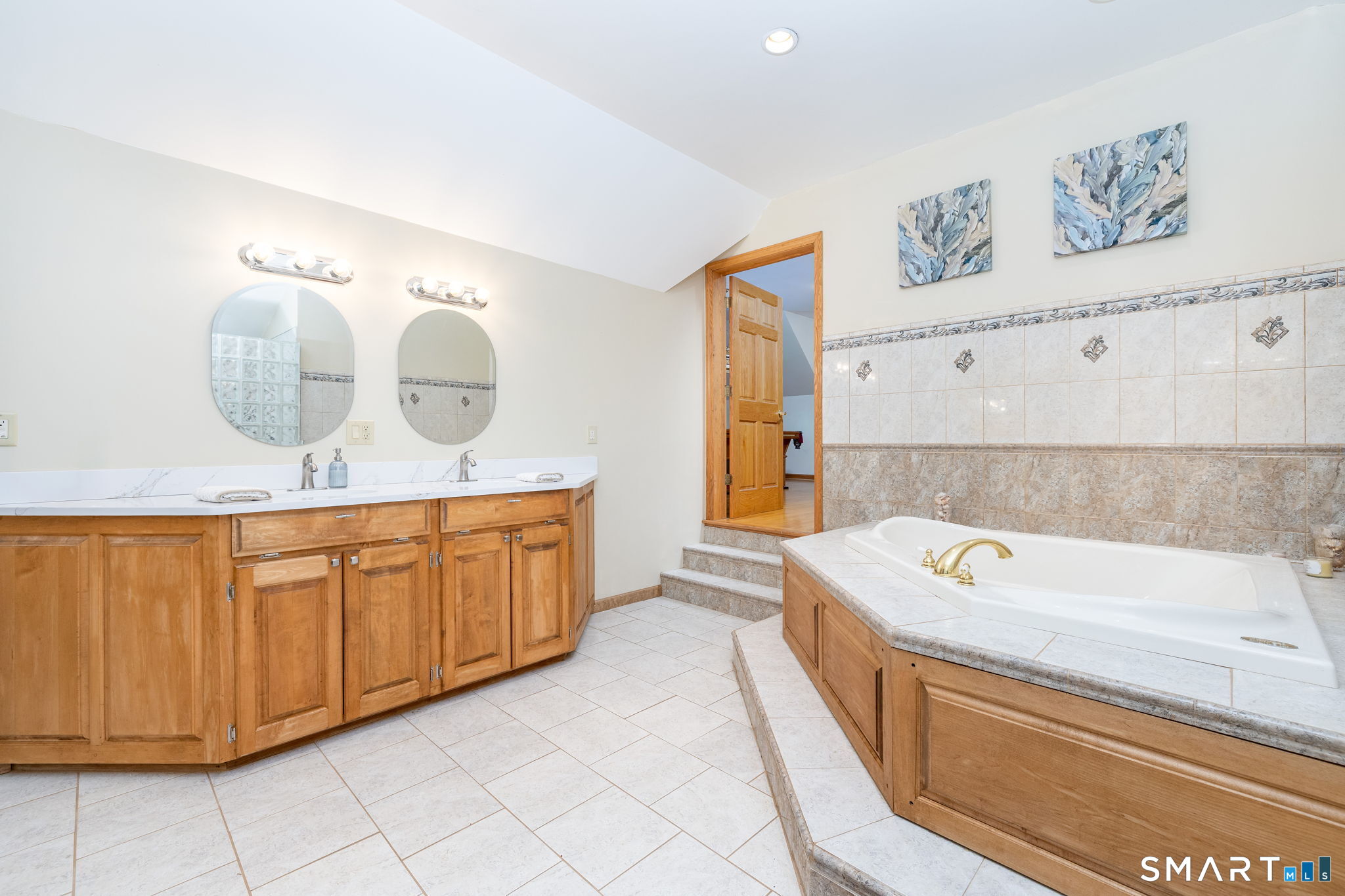 39 Chapman Road Marlborough, CT 06447 - Photo 22 of 40 a bathroom with a sink double vanity and a tub