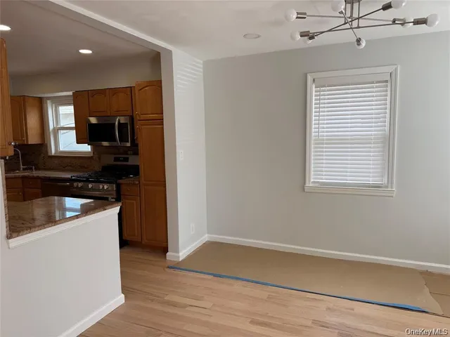 a kitchen that has a sink and a stove in it
