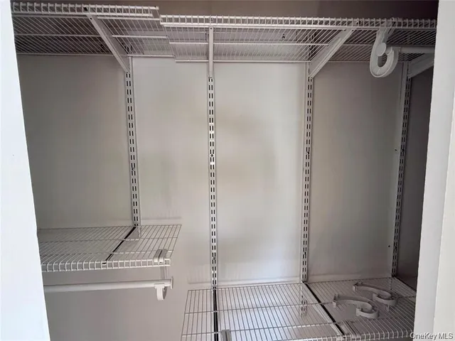 a bathroom with a shower and a sink