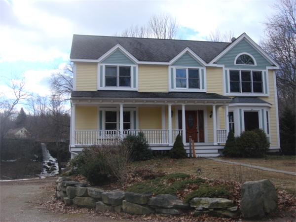 1 Flaxfield Road Dudley, MA 01571 - Photo 1 of 9 a front view of a house with garden
