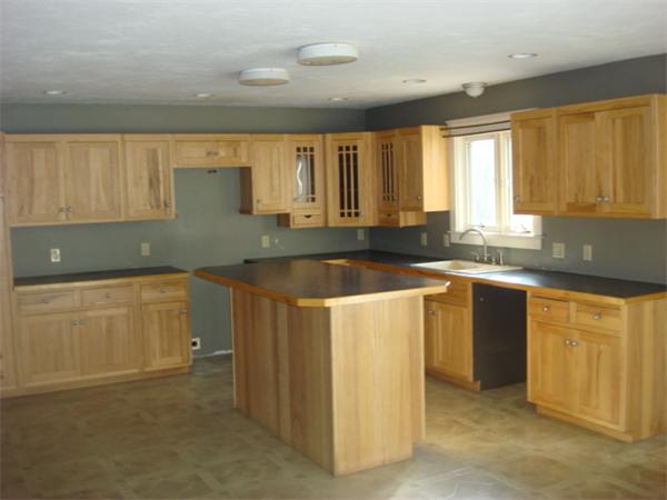 1 Flaxfield Road Dudley, MA 01571 - Photo 2 of 9 a kitchen with granite countertop a sink and white cabinets