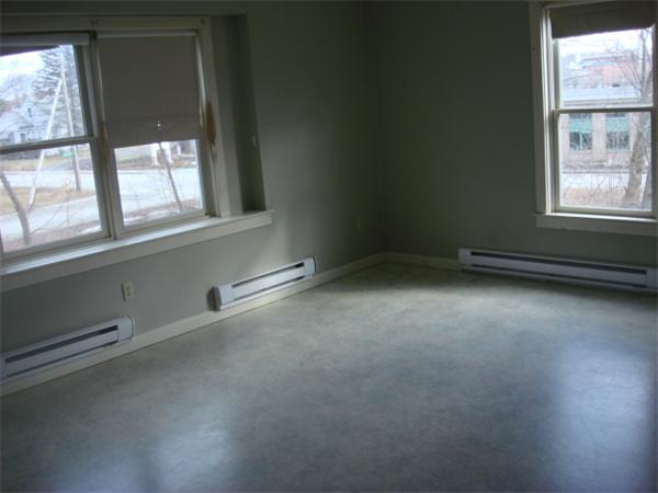 1 Flaxfield Road Dudley, MA 01571 - Photo 7 of 9 an empty room with a empty space and windows