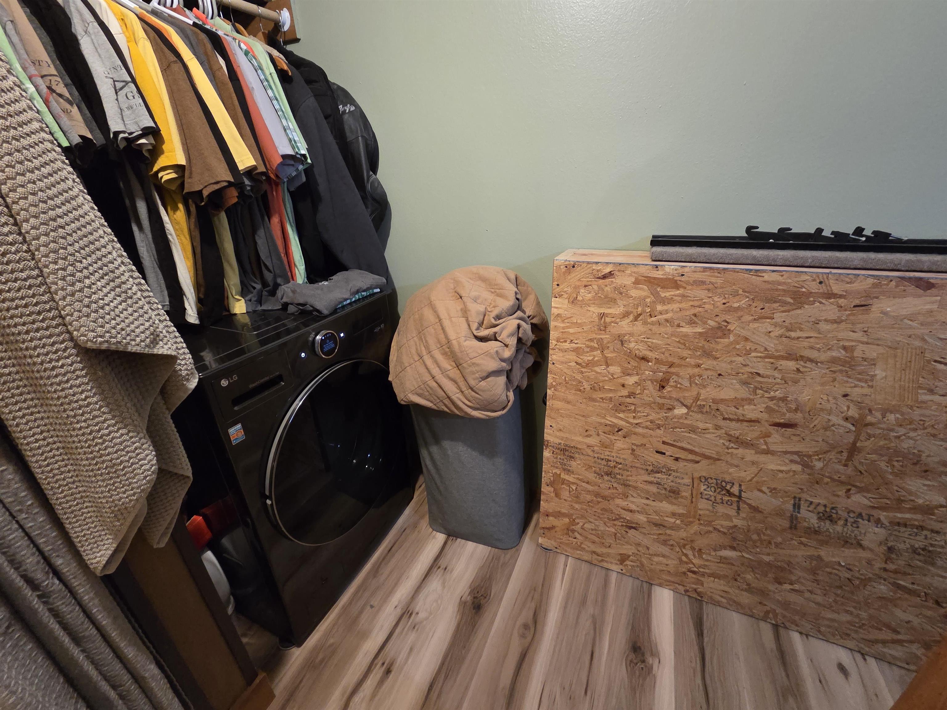 6821 Barrett Road Chisholm, MN 55719 - Photo 13 of 34 Laundry room featuring wood finished floors and washer / dryer