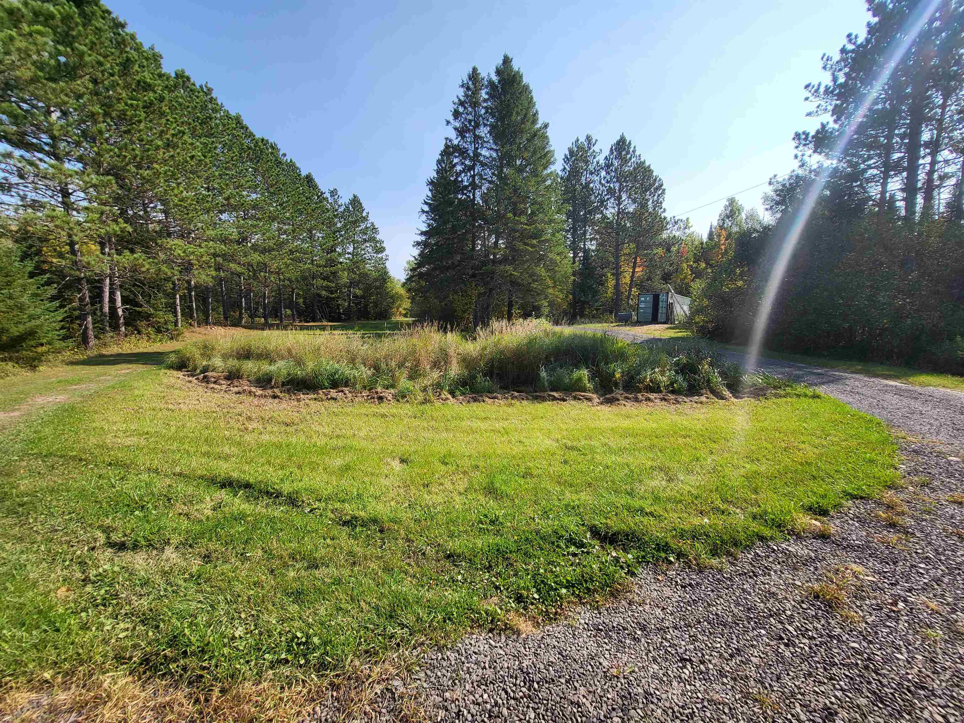 6821 Barrett Road Chisholm, MN 55719 - Photo 18 of 34 View of dirt / gravel road featuring a view of trees