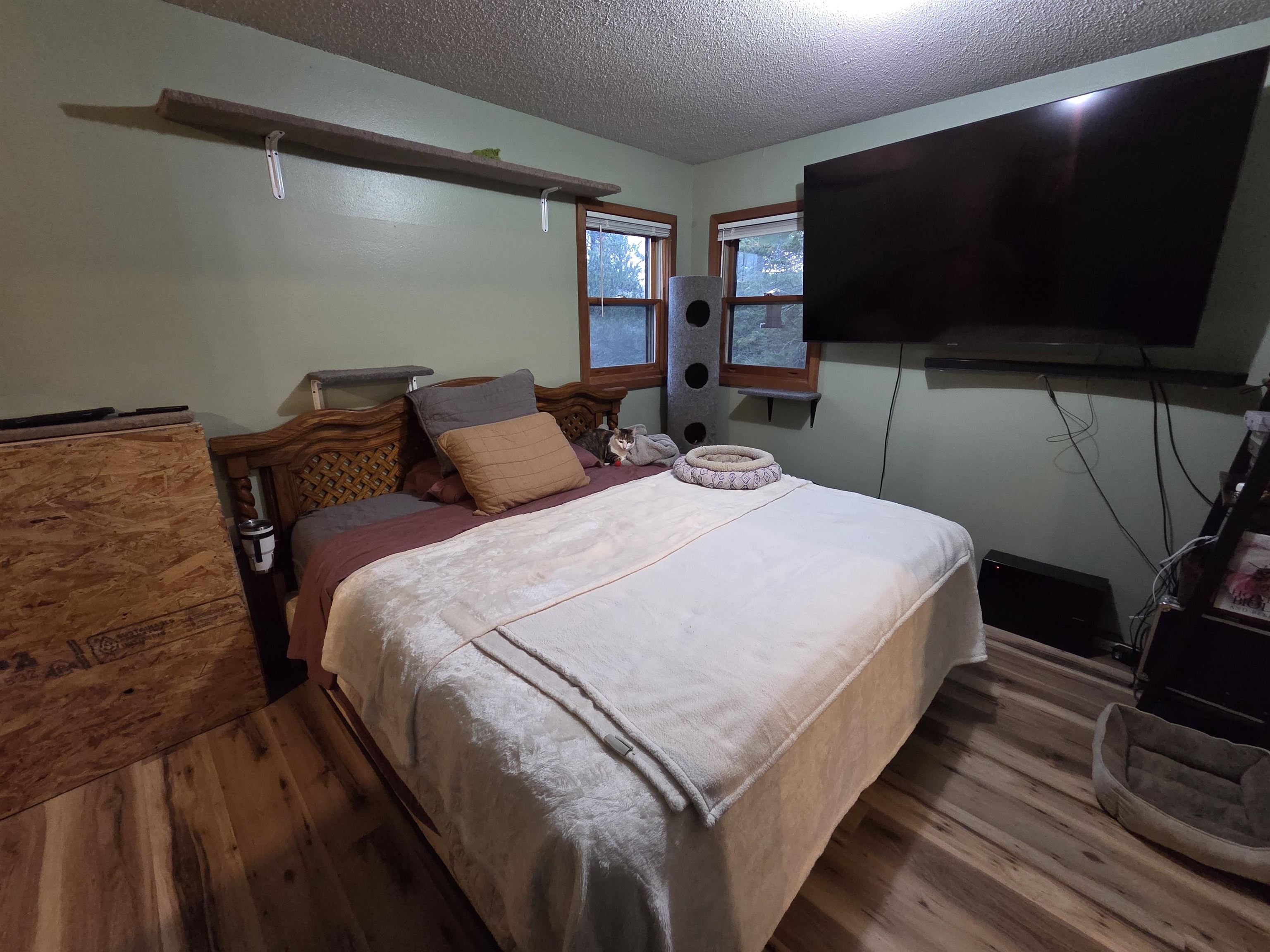 6821 Barrett Road Chisholm, MN 55719 - Photo 9 of 34 Bedroom with wood finished floors and a textured ceiling