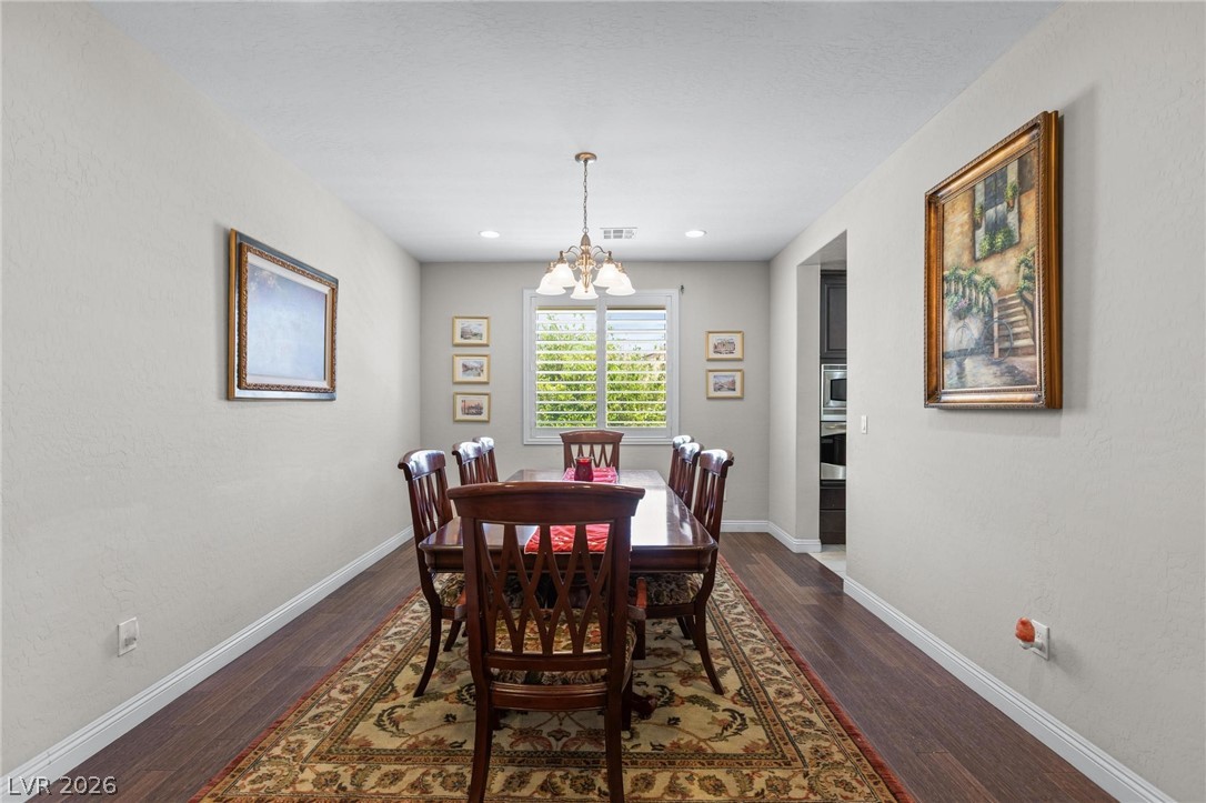 8431 Durango Ranch Court Las Vegas, NV 89113 - Photo 14 of 49 This elegant dining area boasts beautiful flooring and abundant natural light.