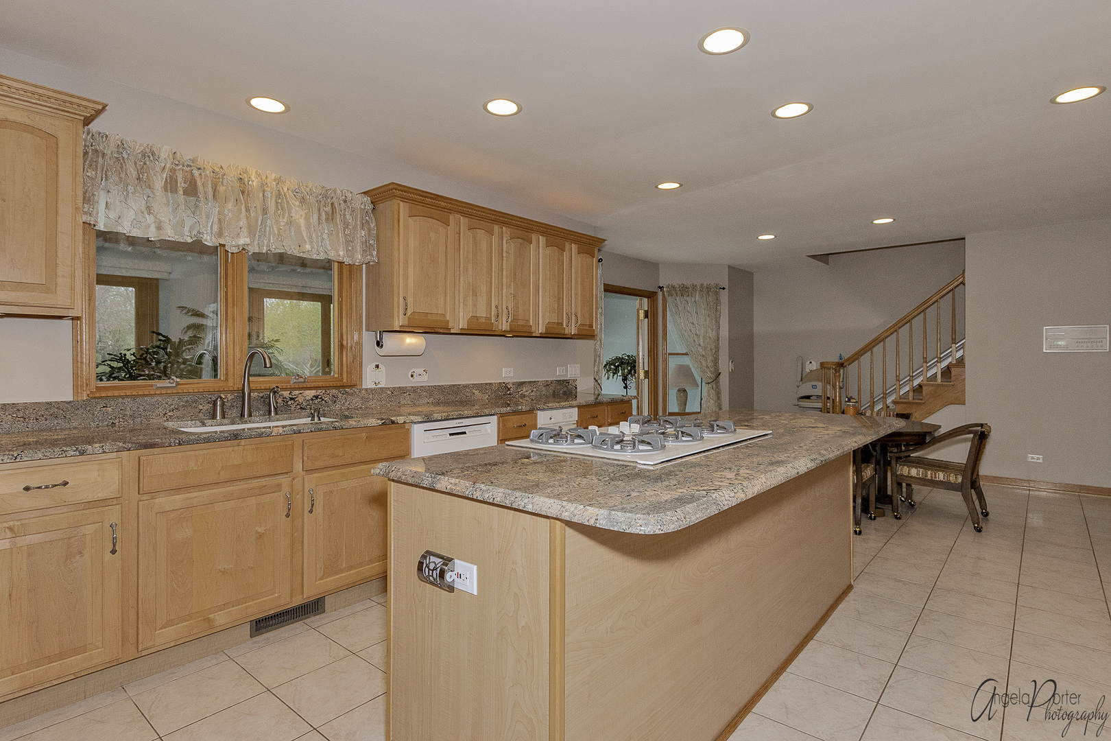 6905 Prairie Drive Spring Grove, IL 60081 - Photo 22 of 57 a kitchen with stainless steel appliances granite countertop a sink and a white cabinets