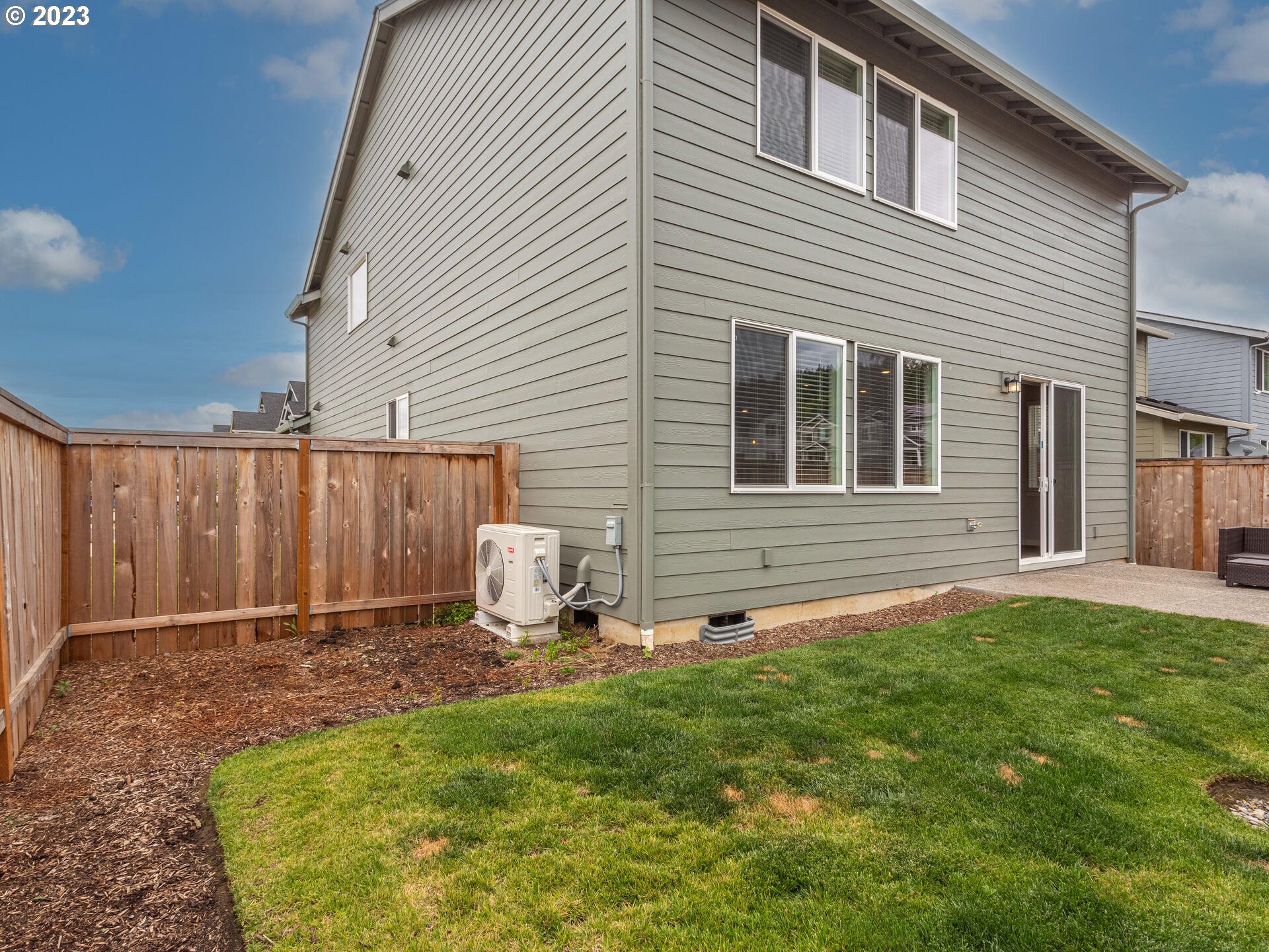 6852 North 89th Loop Camas, WA 98607 - Photo 31 of 38 a backyard of a house with table and chairs