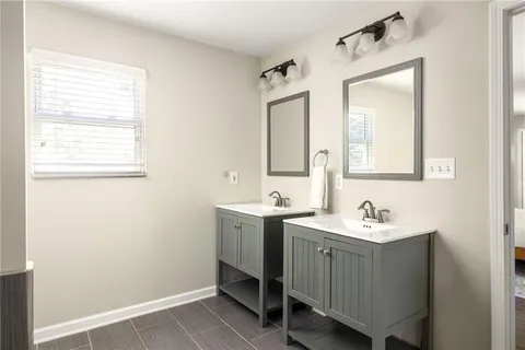a bathroom with a tub and a sink