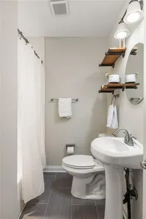 a view of a livingroom with washer and dryer