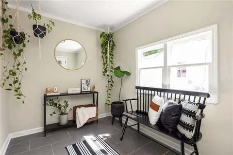 a living room with furniture and a window